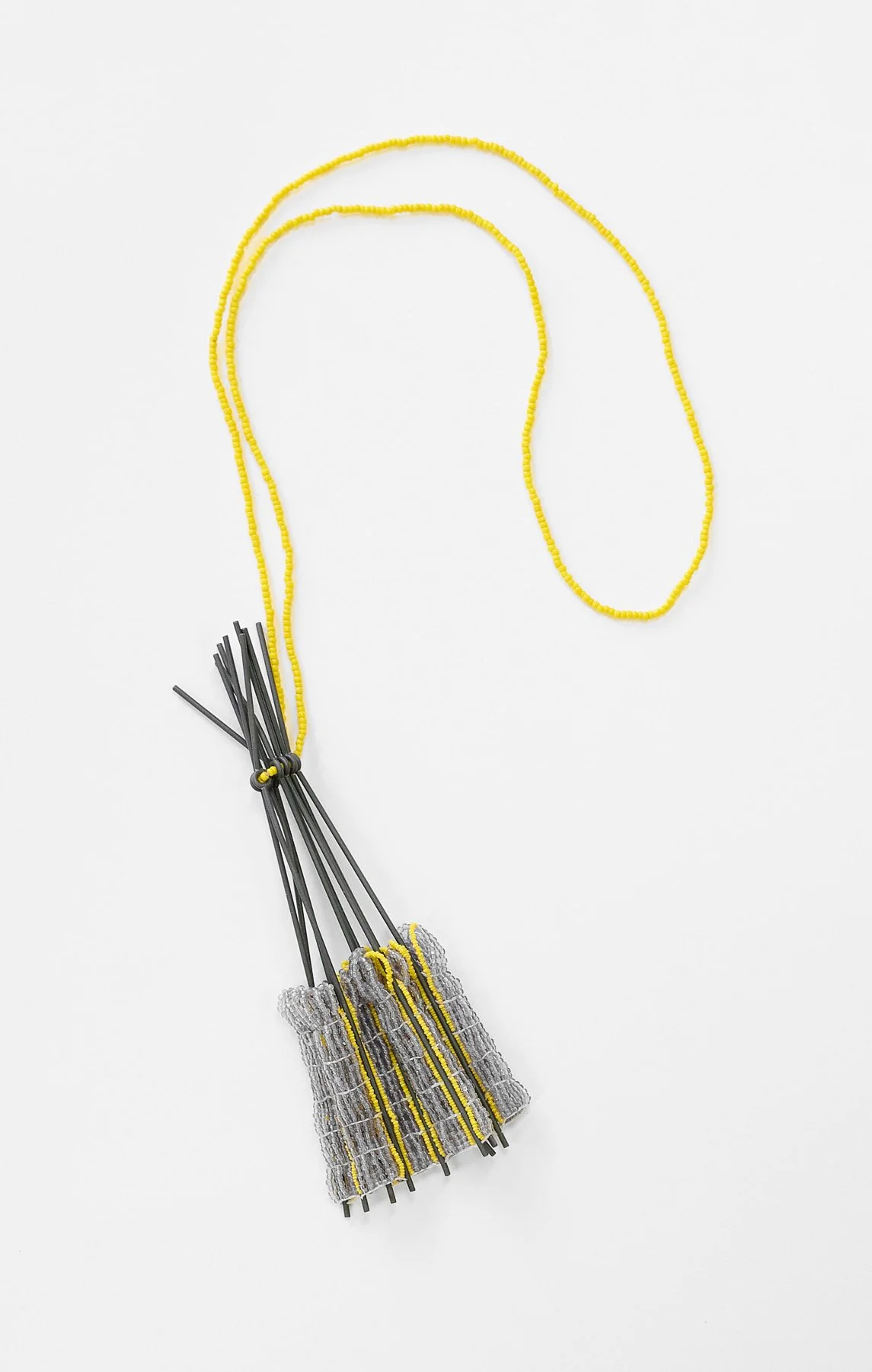 28. Mascha Moje, ‘Untitled’, (drying flowers), 2025, oxidized mild steel and woven yellow and mauve glass beads, pendant 6x15cm, cord 30cm. Price: $1,700 