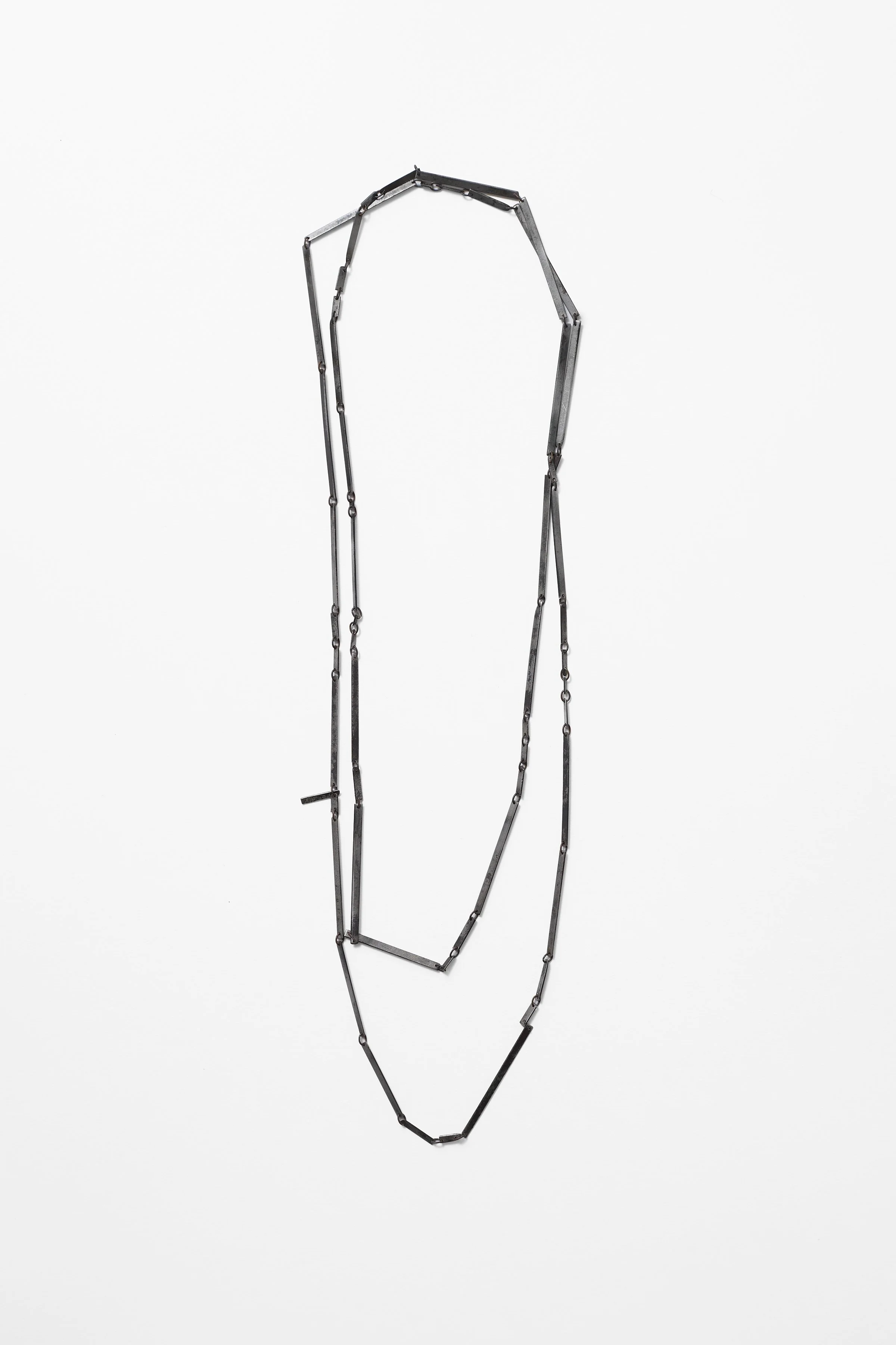 53. Melissa Cameron, ‘rapidly #b – chain’, 2024, found steel street sweeper blades, stainless steel chain links, brushed steel, 145cm chain. Price: $450