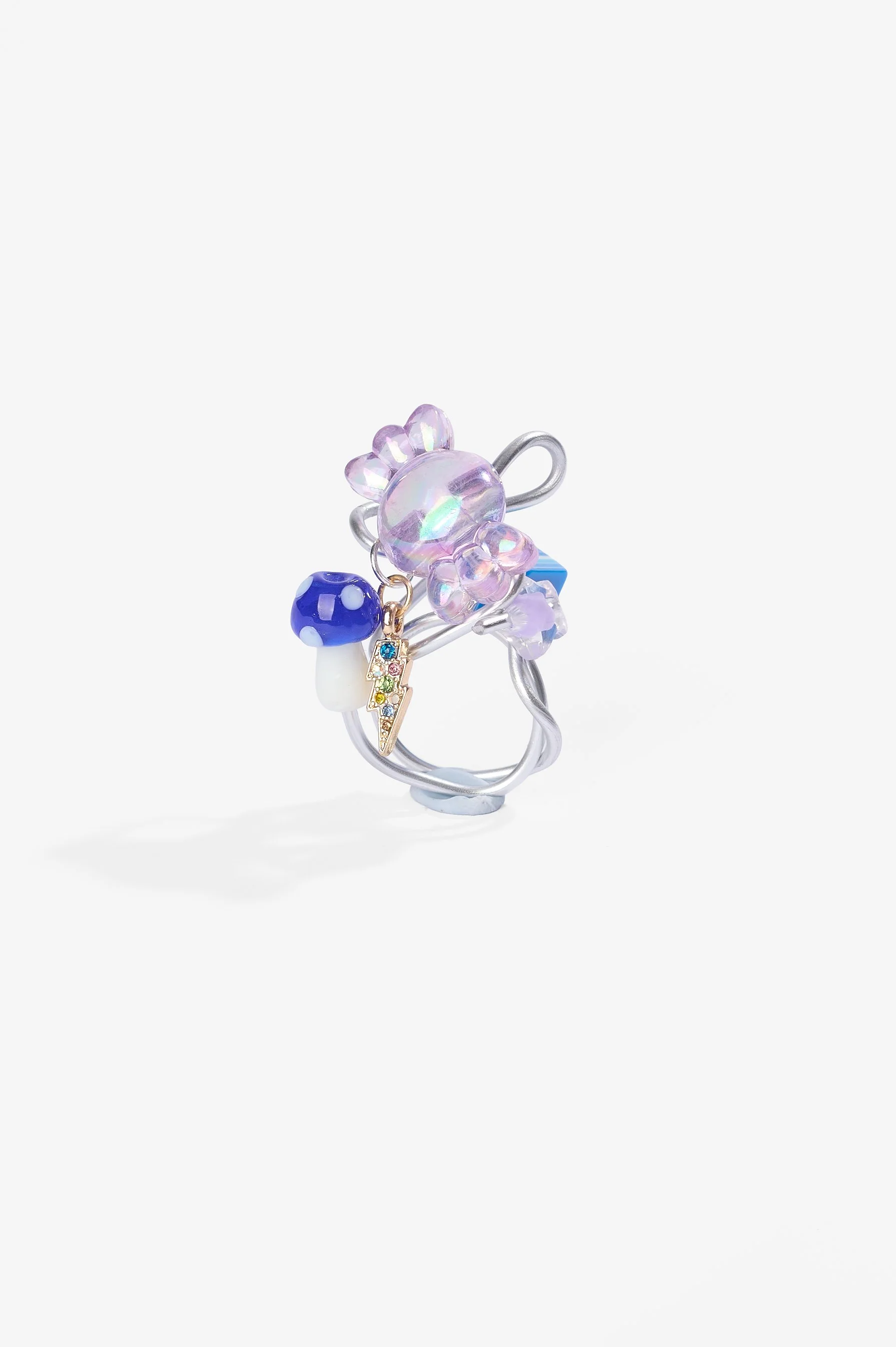 Roma Turnbull-Coulter, Purple ring, aluminium wire, metal trinket, plastic and glass beads, 2026, $75. Photography: Ross Coulter