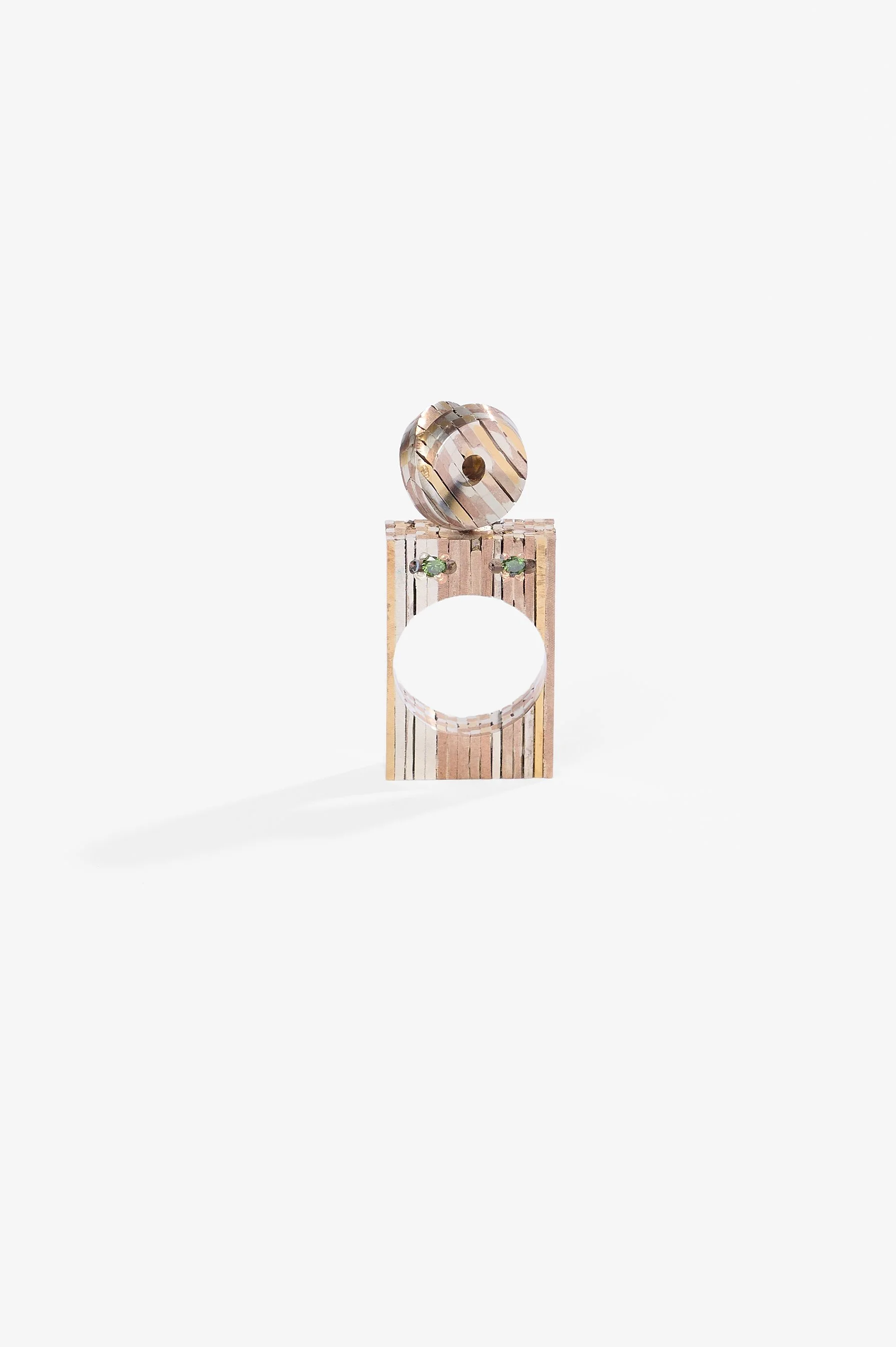 Helen Dilkes, Metal alloys puffy self-intersecting surface finger sculpture, 24kt gold, 999 silver, 925 silver, shakudo, shibuichi, green diamonds, 65 x 25 x 6mm, 2015-2026, $3,500. Photography: Ross Coulter