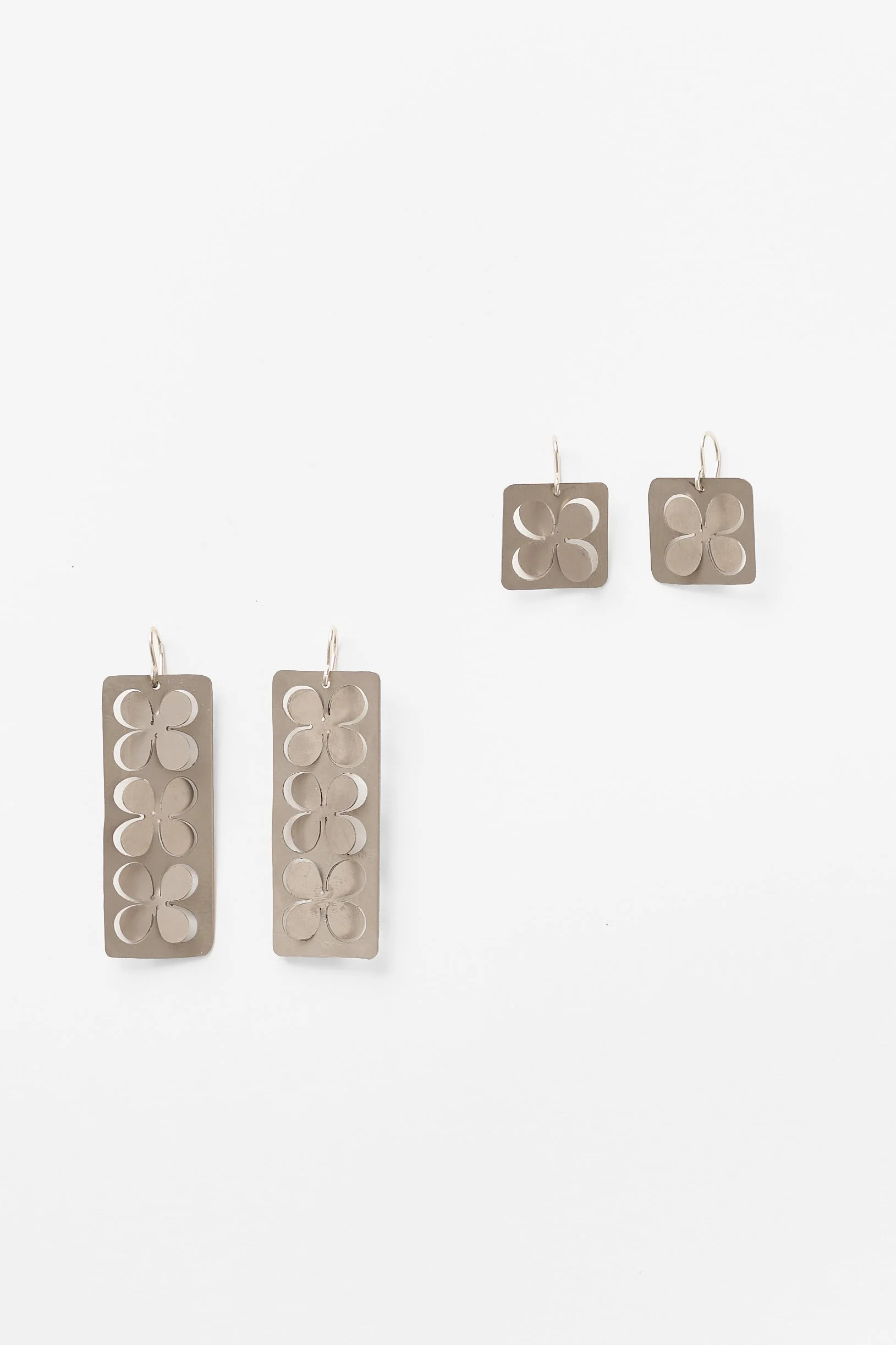 72. Elisa Zorraquin, ‘Vaivén I, II’, (triple flower), 2026, earrings, titanium, sterling silver, each earring measures: 6x1.9x1.2cm. Price: $220 and 73. ‘Oscillation I, II’, (single flower), 2026
earrings, titanium, sterling silver, each earring mea