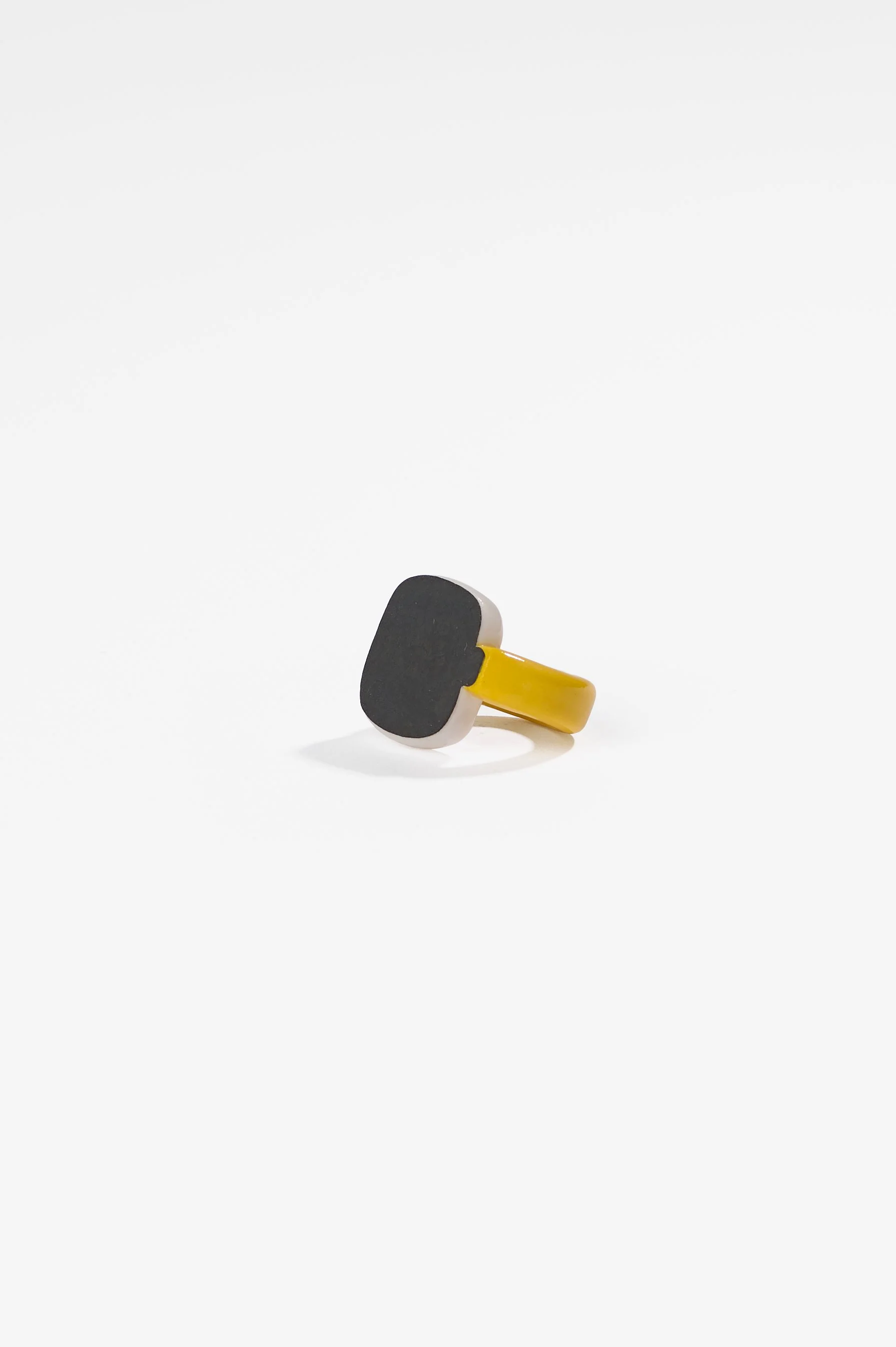 Manon van Kouswijk, Rings for Found Hands (yellow, black and white), porcelain, dimensions vary per ring, 2026, $590 each. Photography: Ross Coulter