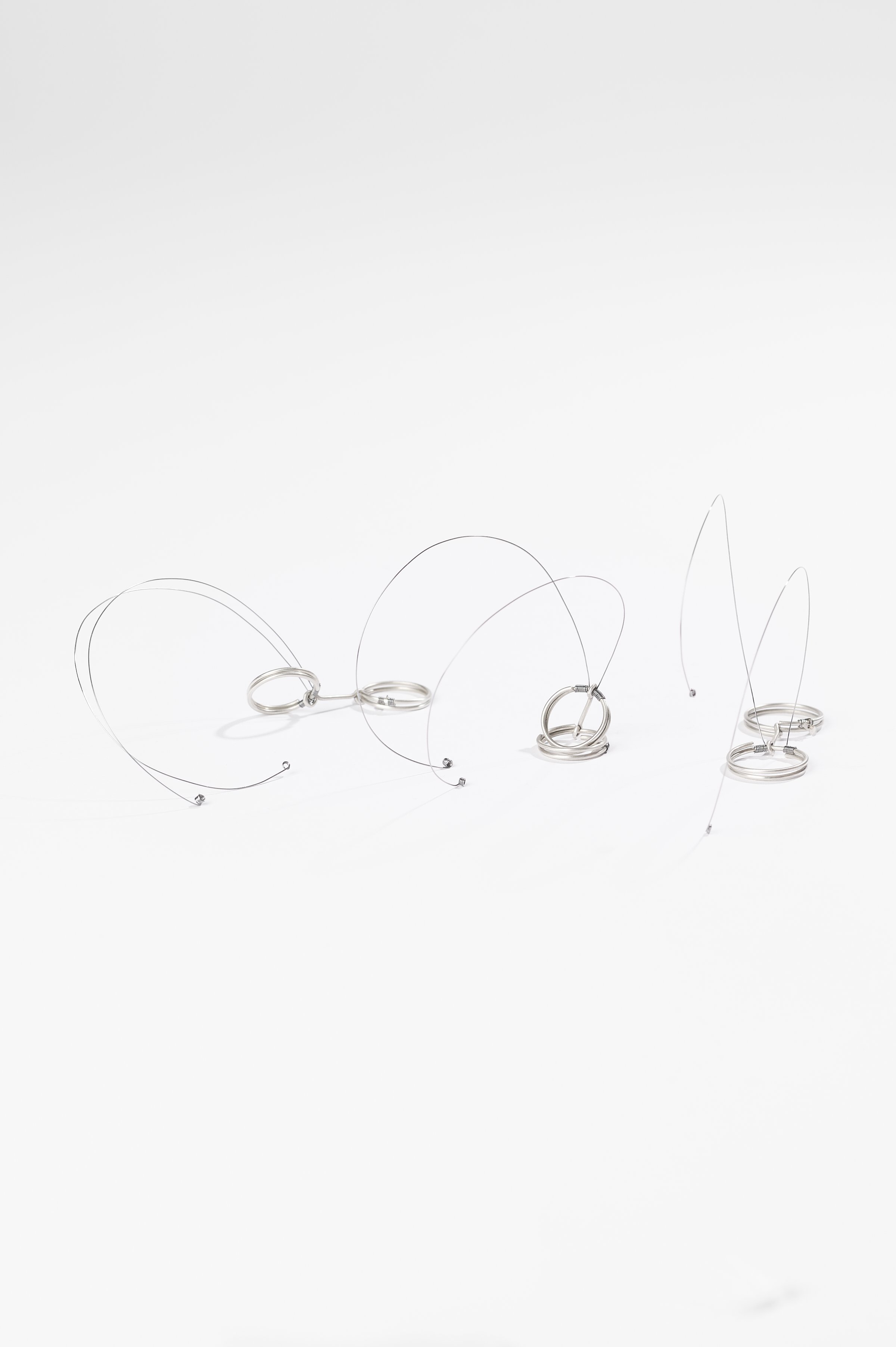 Nadia Cao-Alahananthan, Ơi (Uh-ee) Ring, sterling silver wire, binding wire, 10 x 1.9 x 6cm, 2026, $190 each. Photography: Ross Coulter