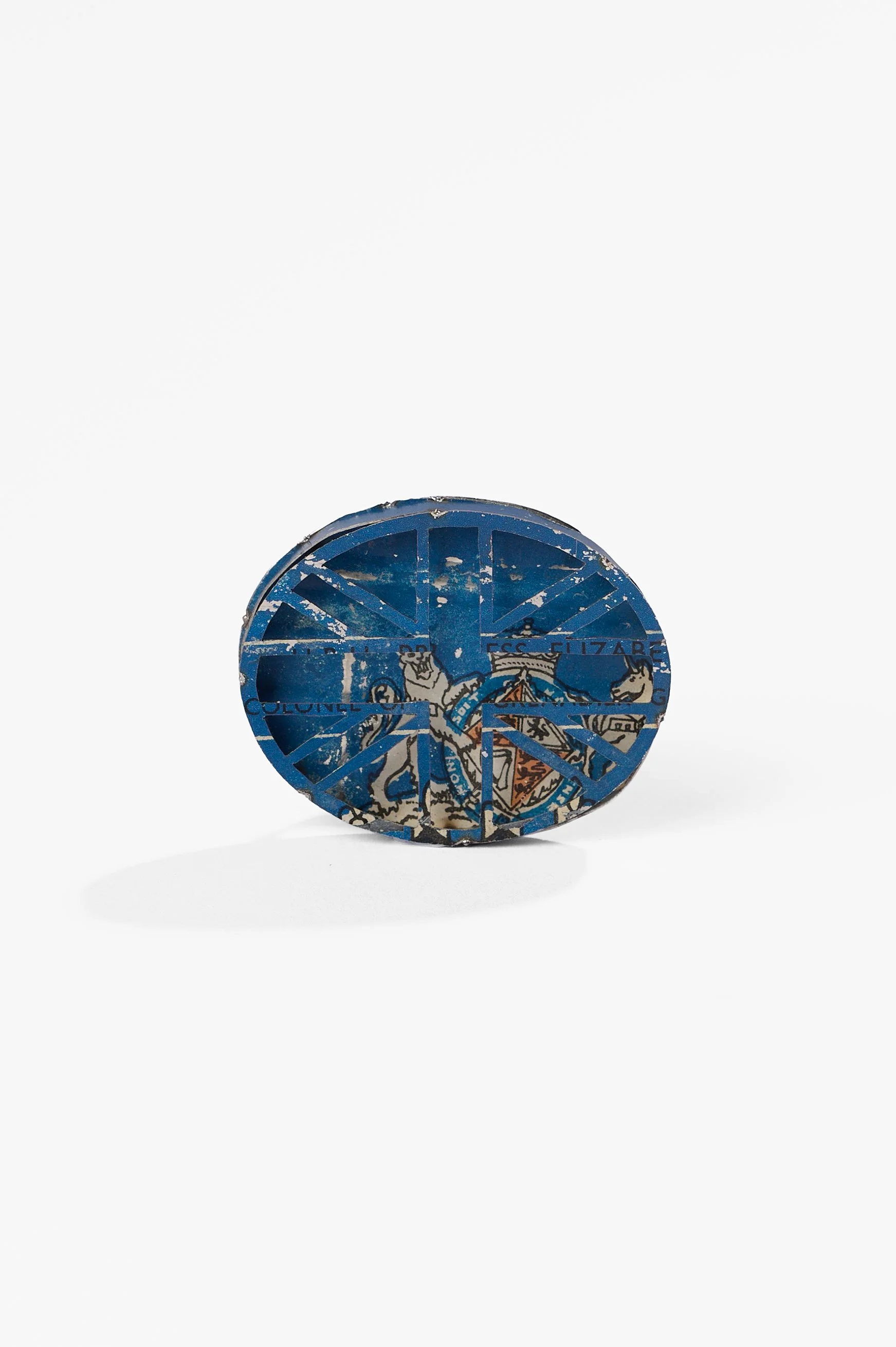 Anna Davern. 'Union Jack ring (blue)' biscuit tin, 50x40x25mm, size , 2026, $380. Photography: Ross Coulter