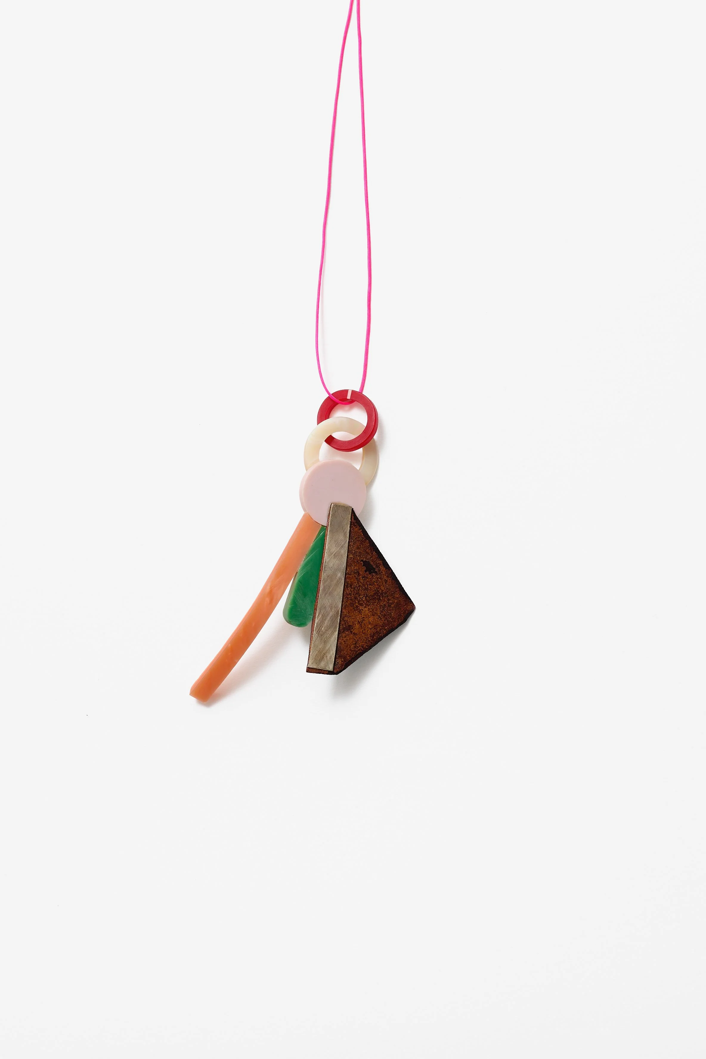 40. Danny Schwaag, ‘solo / – movement 10’, pendant/(wall) object, 2022, galalith, mother of pearl, enamel on copper, silver, 9.5x6x2.5cm. Price: $1,100