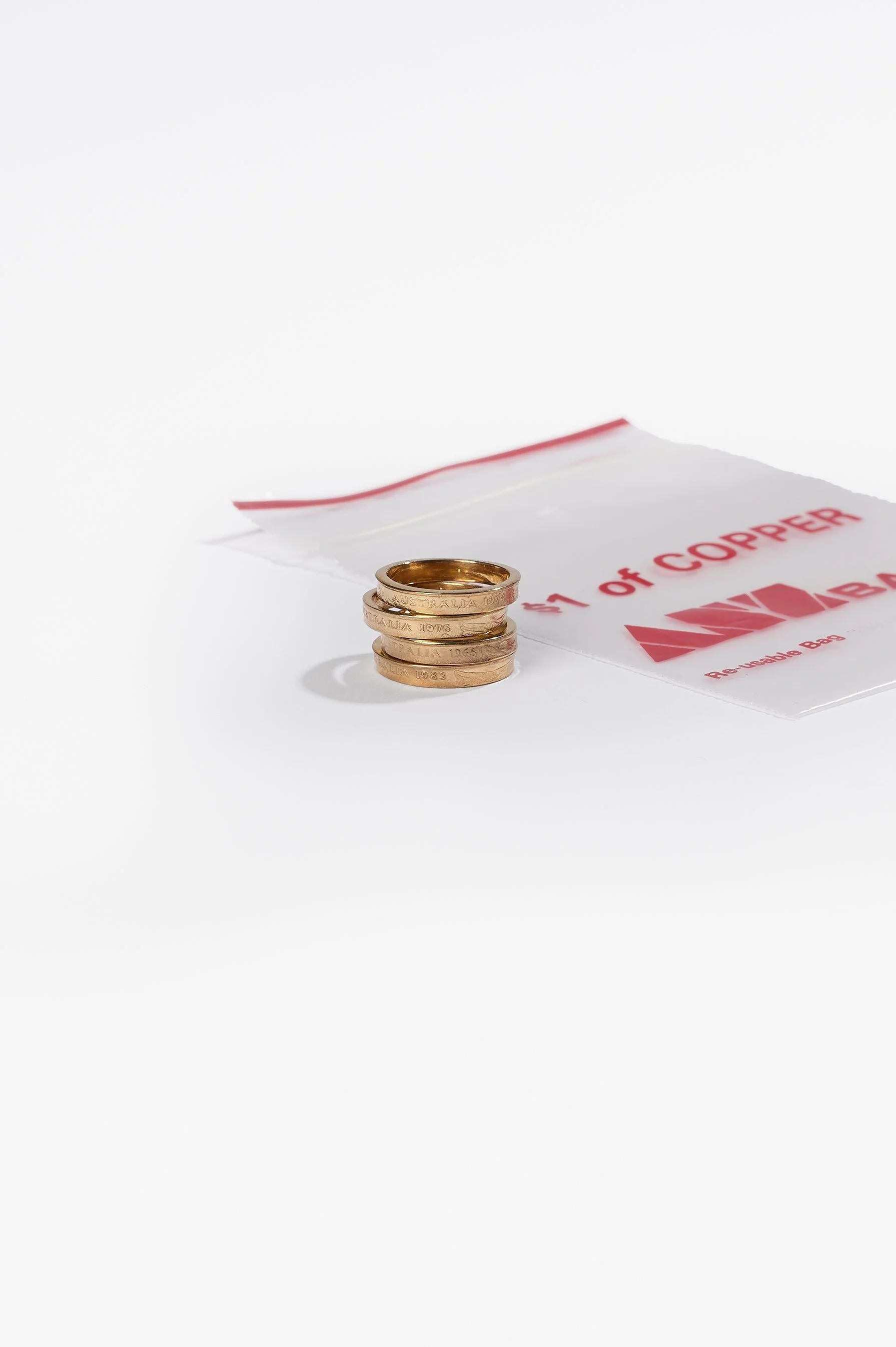 Sarah Ross, Recession rings 2.0, copper 2 cent coin, 24ct gold plate, various dates and sizes available, 2026, $290 each. Photography: Ross Coulter