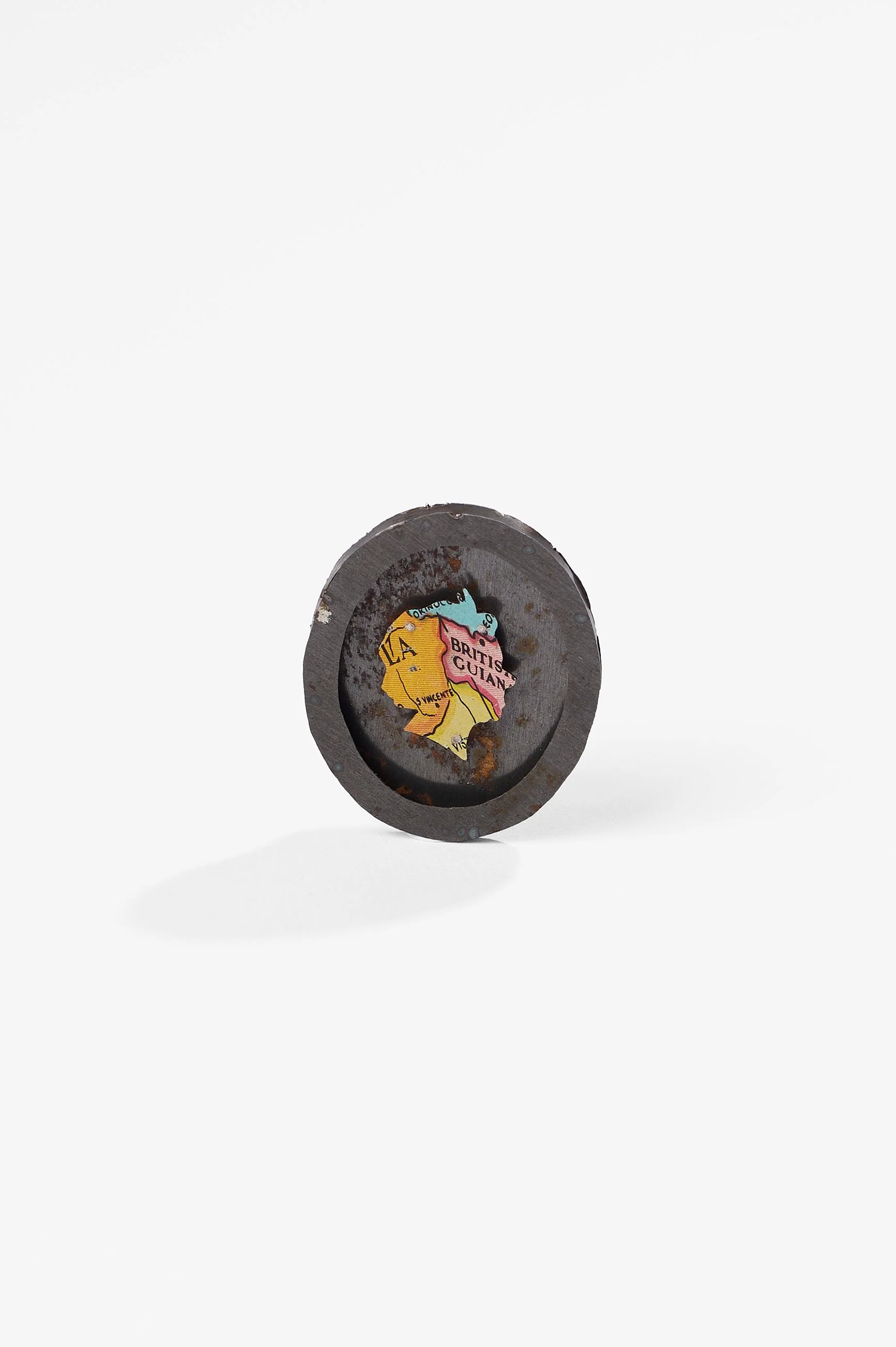 Anna Davern. 'Empire ring (British Guiana)', biscuit tin, tin globe, 40x35x22mm size , 2026, $380. Photography: Ross Coulter