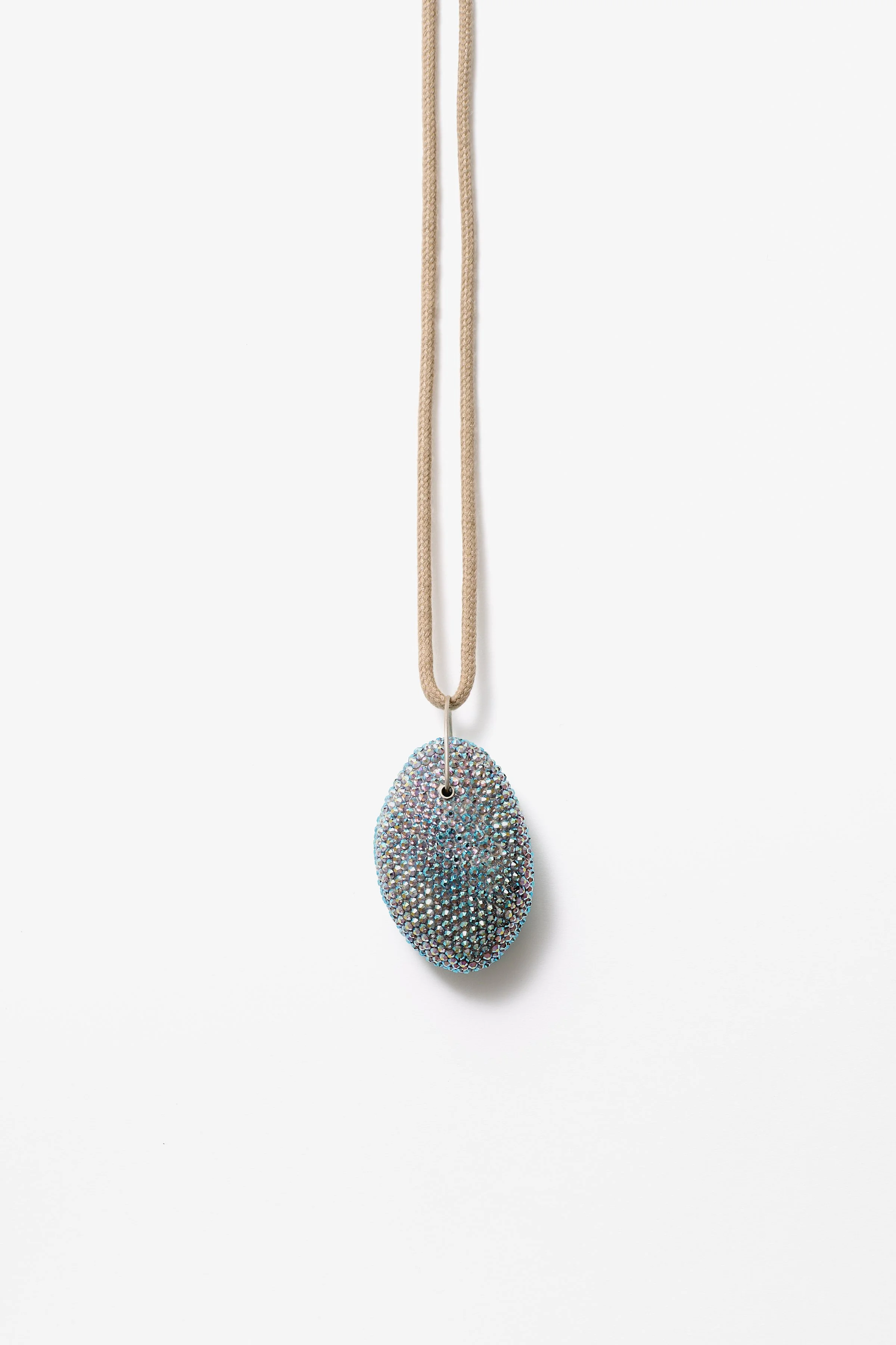 35. Raewyn Walsh, ‘lilac ash’, rhinestone pendant, (pale blue), 2025, found pumice, preciosa crystals, stg silver, shoelace, 8x4.5x3cm, cord 35cm. Price: $450
