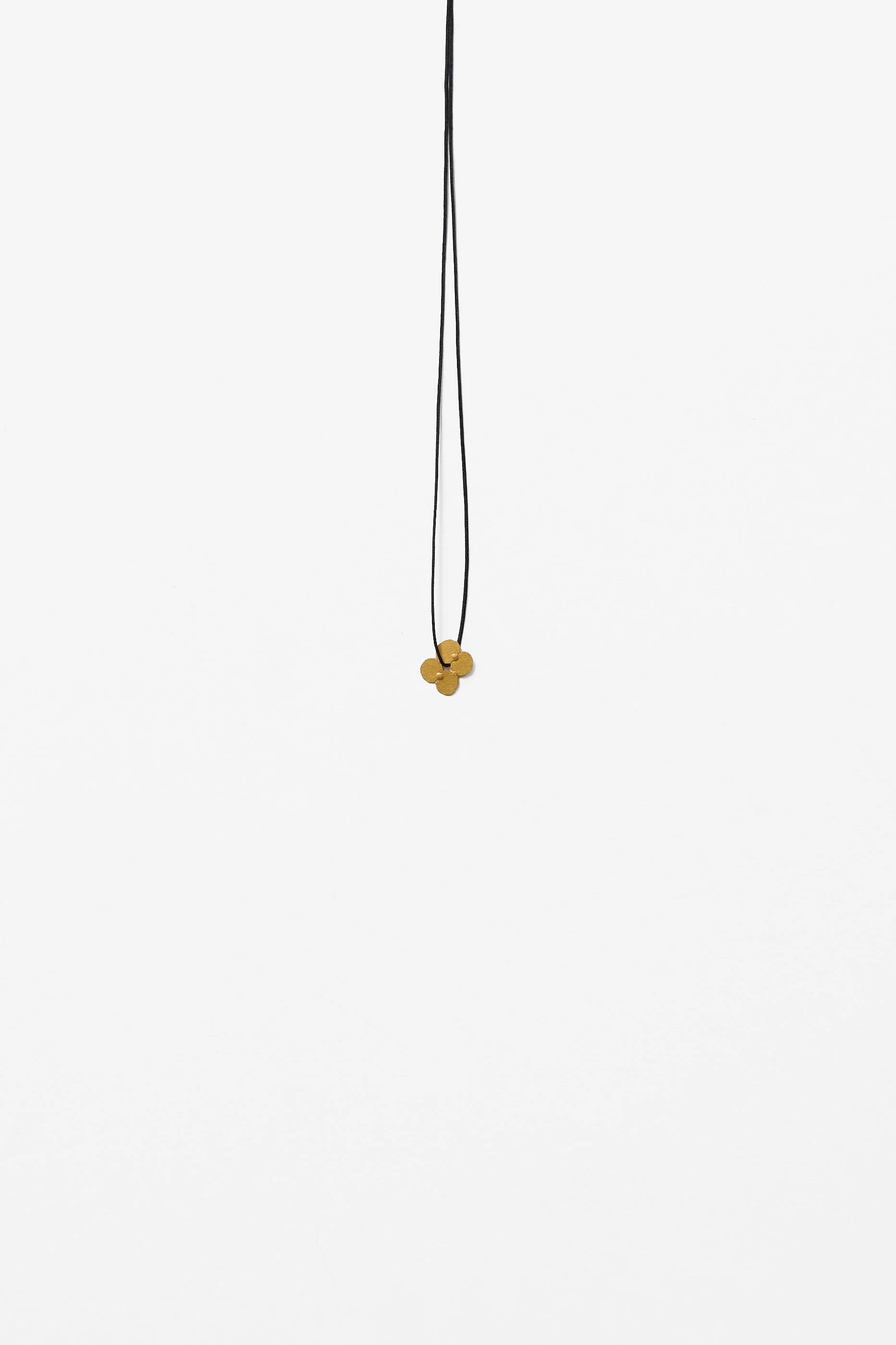 21. Mascha Moje, ‘Squishes’, (gold), 2023
Fine gold, 1×1×.2cm, 40cm cord. Price: $600
(Price subject to change)