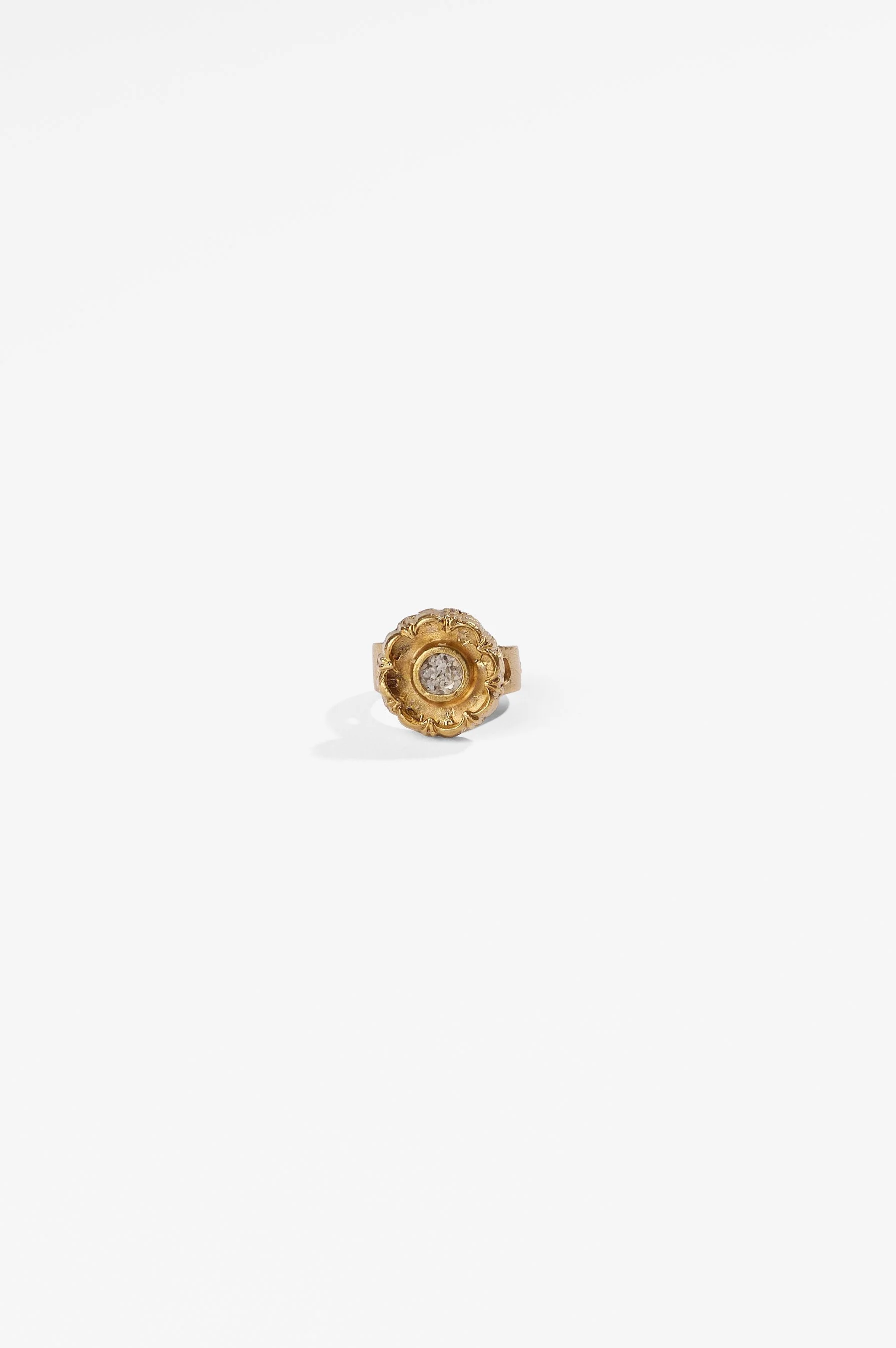 Laila Marie Costa, Untitled 23 (gold sconced flower design, internal circle setting), bronze (gold plated) and white diamond powder, $1000. Photography: Ross Coulter