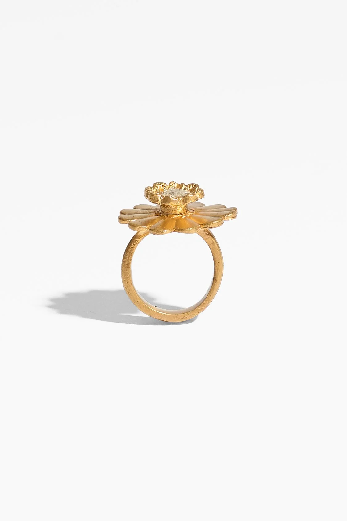 Laila Marie Costa, Untitled 14 (large gold dual flower large daisy shape plus smaller flower horizontal), bronze (gold plated) and white diamond powder, 3 x 3 x 3cm, 14.5 grams, $1100. Photography: Ross Coulter