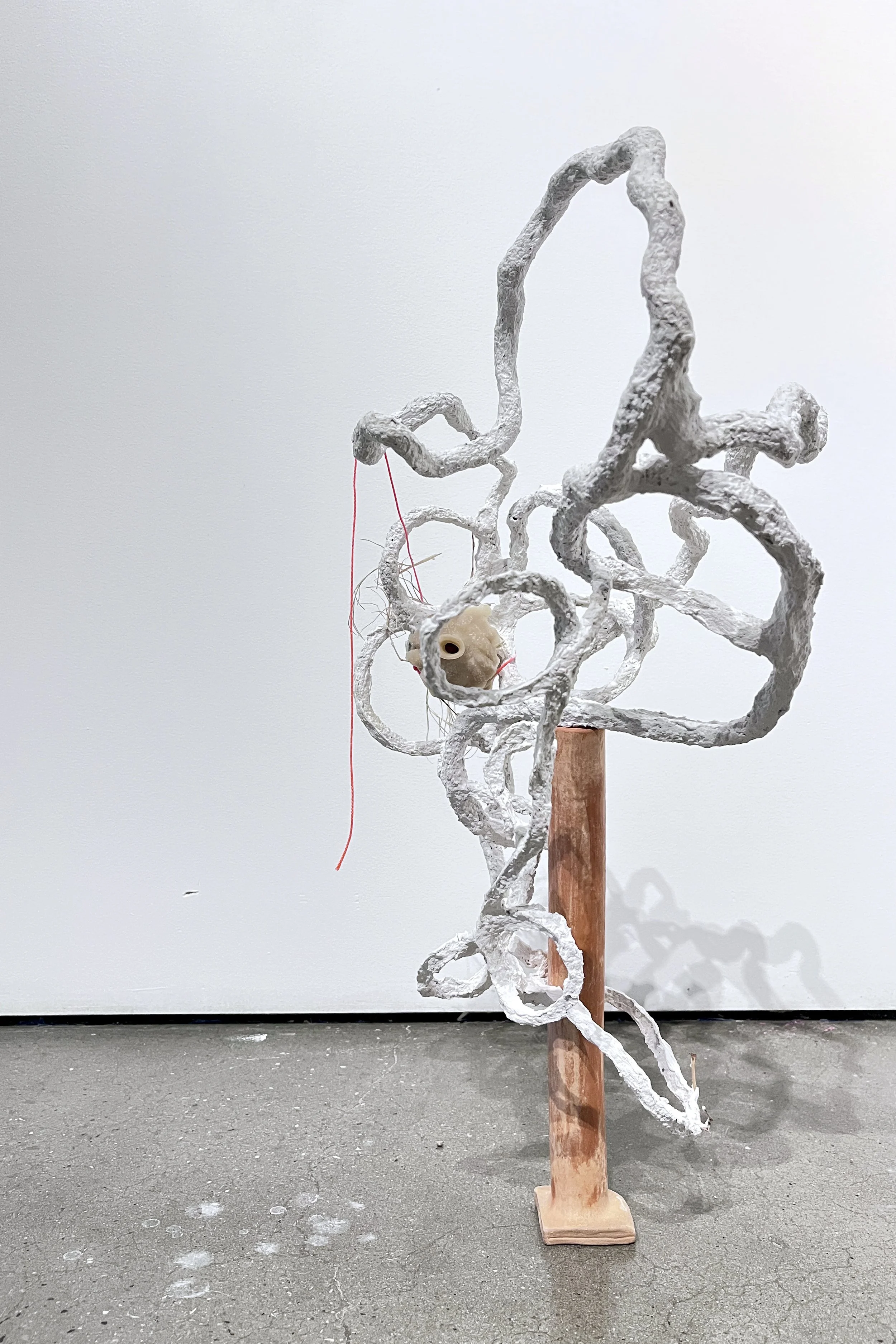 Benjamin Woods, ‘Buzzing and agglomerating when inundated (skinks)’, 2025 seagrass twine, beeswax flute (2023), grass from Skink territory in "Royal Park", wire, paper pulp, pva, plaster, gesso, builders’ twine, terracotta and bamboo paper clay flute
