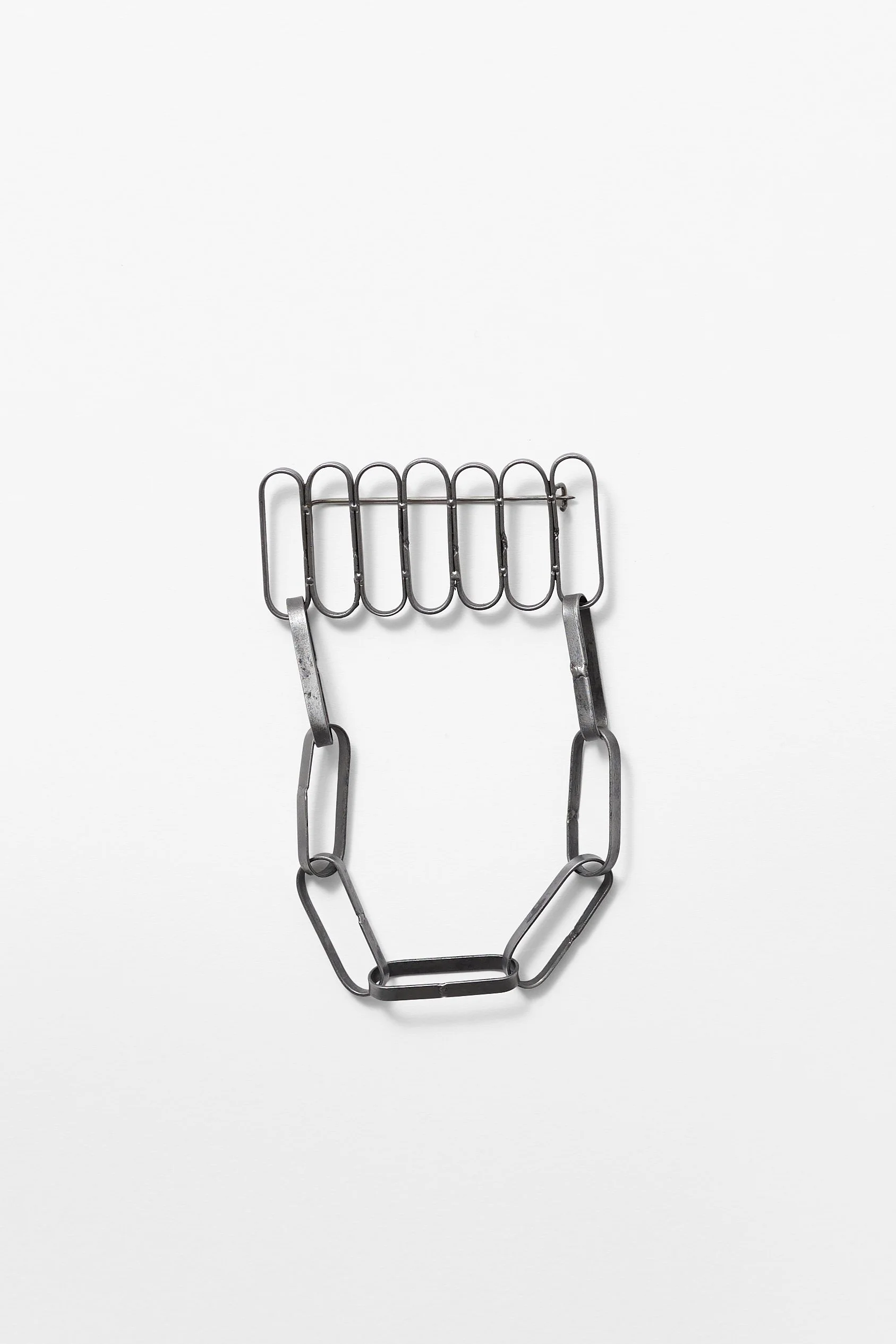 52. Melissa Cameron, ‘rcw...#1 brushed chain brooch 01’, 2024, found steel street sweeper blades, stainless steel, brushed finish, 6x10.5x1cm. Price: $480