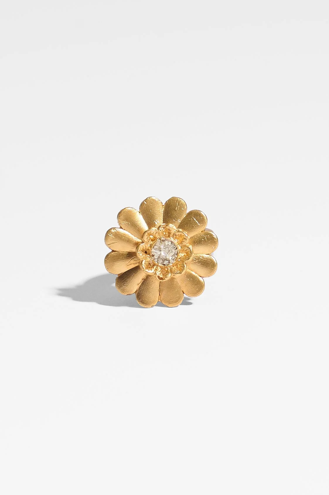 Laila Marie Costa, Untitled 14 (large gold dual flower large daisy shape plus smaller flower horizontal), bronze (gold plated) and white diamond powder, 3 x 3 x 3cm, 14.5 grams, $1100. Photography: Ross Coulter