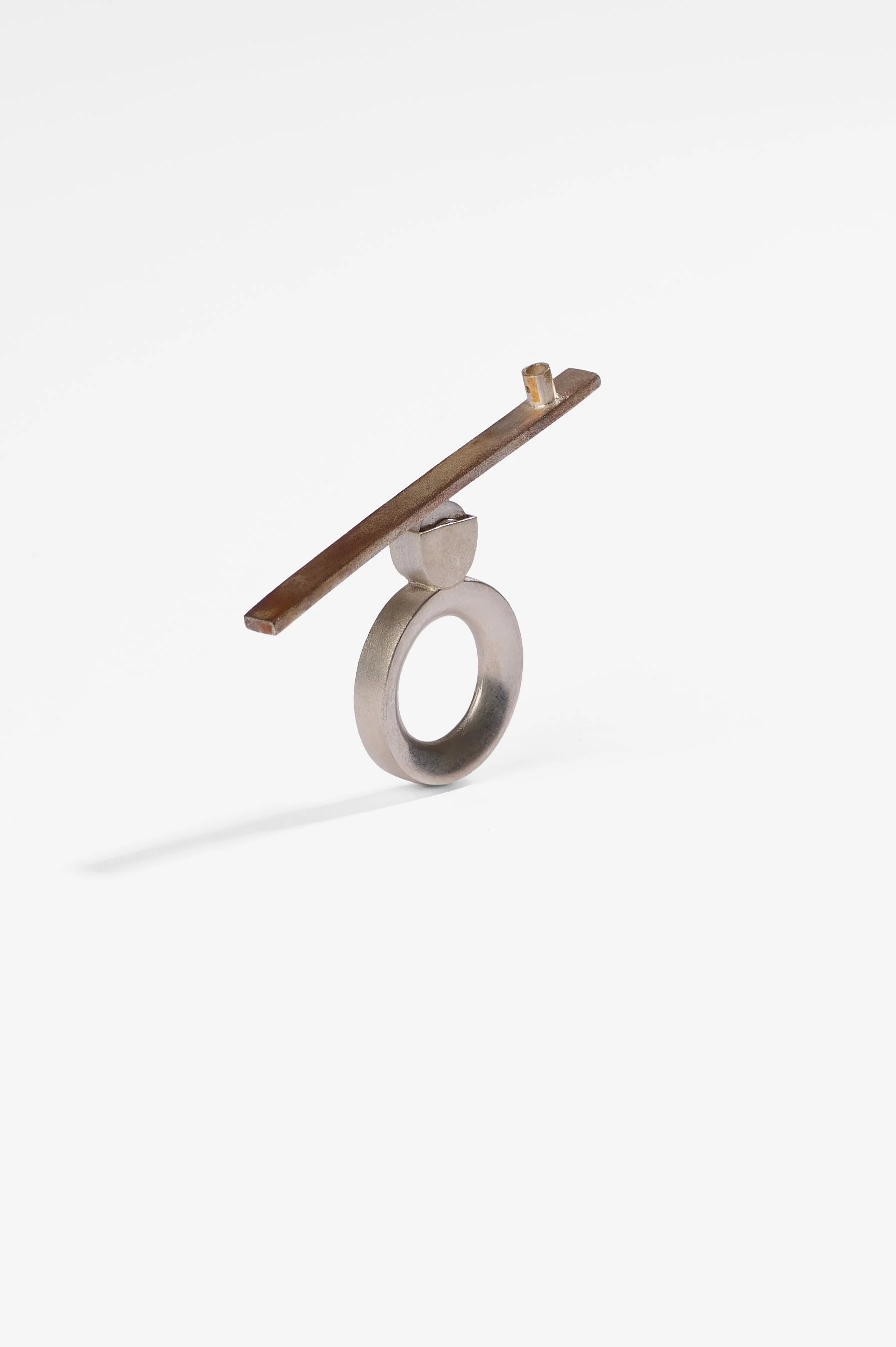 Thao Bui, See saw, sterling silver, shibuichi, 42mm x 69.5mm, 2026, $2,100 Photography: Ross Coulter