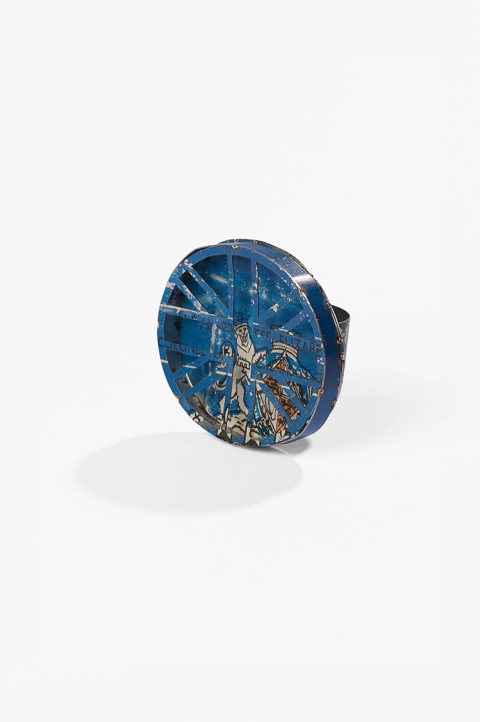 Anna Davern. 'Union Jack ring (blue)' biscuit tin, 50x40x25mm, size , 2026, $380. Photography: Ross Coulter