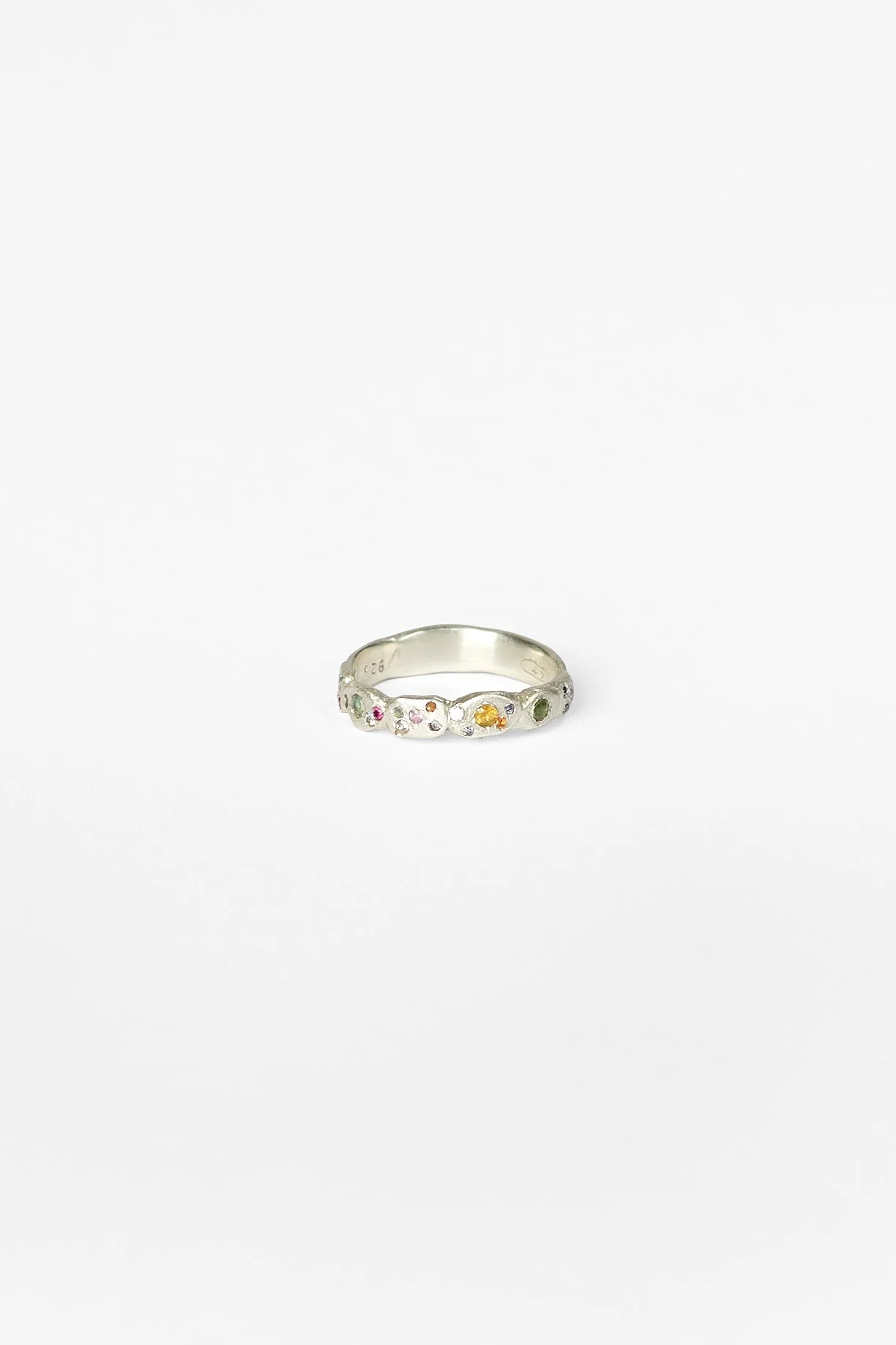 12. Audrey Tan, ‘crumbling footpath iv’, 2026
recycled sterling silver, lab grown gemstones (spinel, corundum, cubic zirconia, moissanite), tourmaline, approx. size N. Price: $450