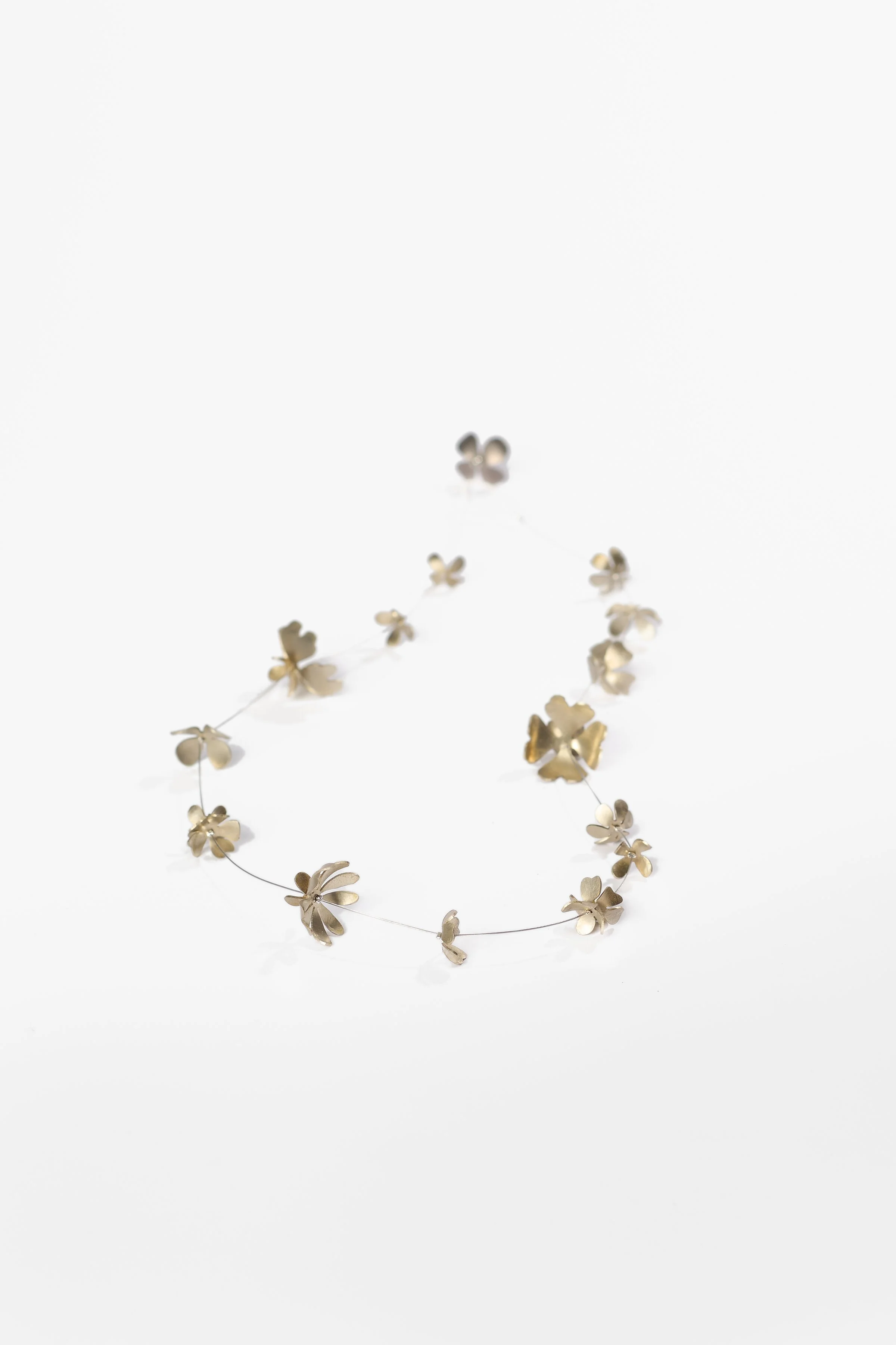 76. Elisa Zorraquin, ‘Las flores salen porque son curiosas (Flowers bloom because they are curious)’, 2026, necklace, nickel silver, titanium, sterling silver, stainless steel, glass beads, crimping wire, necklace 52.5cm (from end to end) x 1.8cm wid