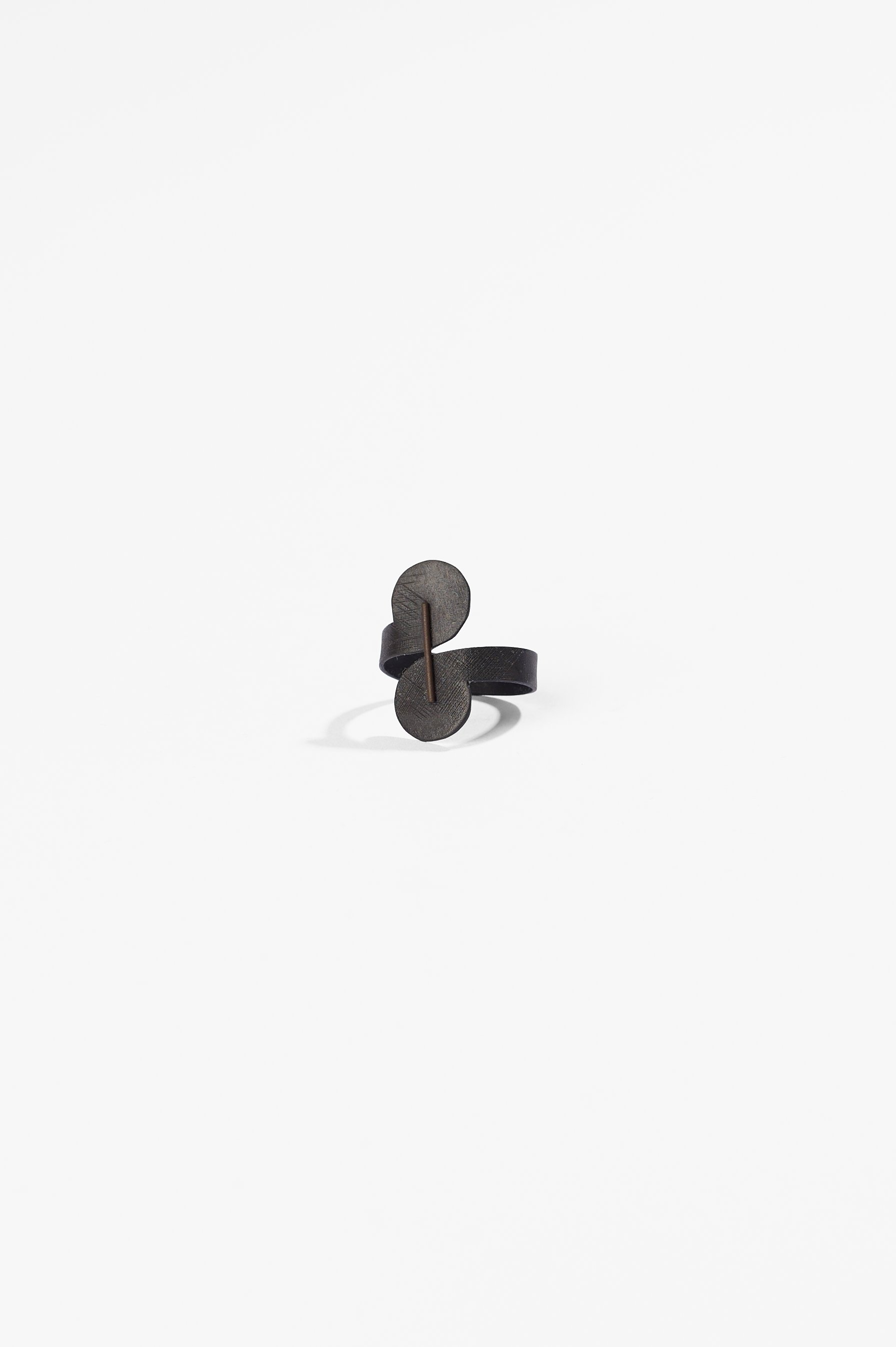 Sue Buchanan, Comma #3, mild steel, stainless steel, blackened, 2026, $220. Photography: Ross Coulter