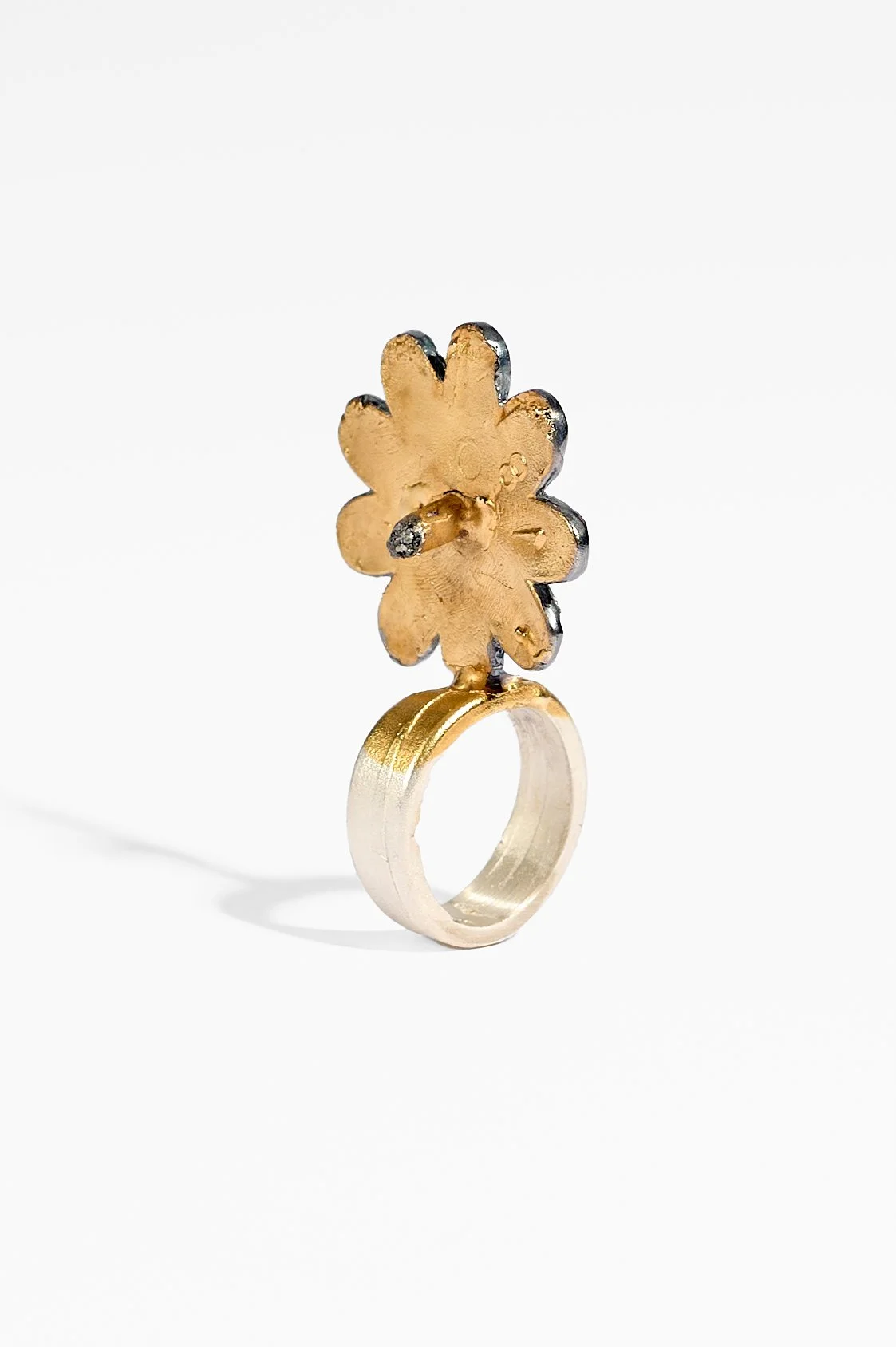 Laila Marie Costa, Untitled 1 (large gold sideways flower with stamen), sterling silver, gold plating, oxidisation, black diamond powder, 3.5 x 5.5 x 2cm, 19.7gms, $1500. Photography: Ross Coulter