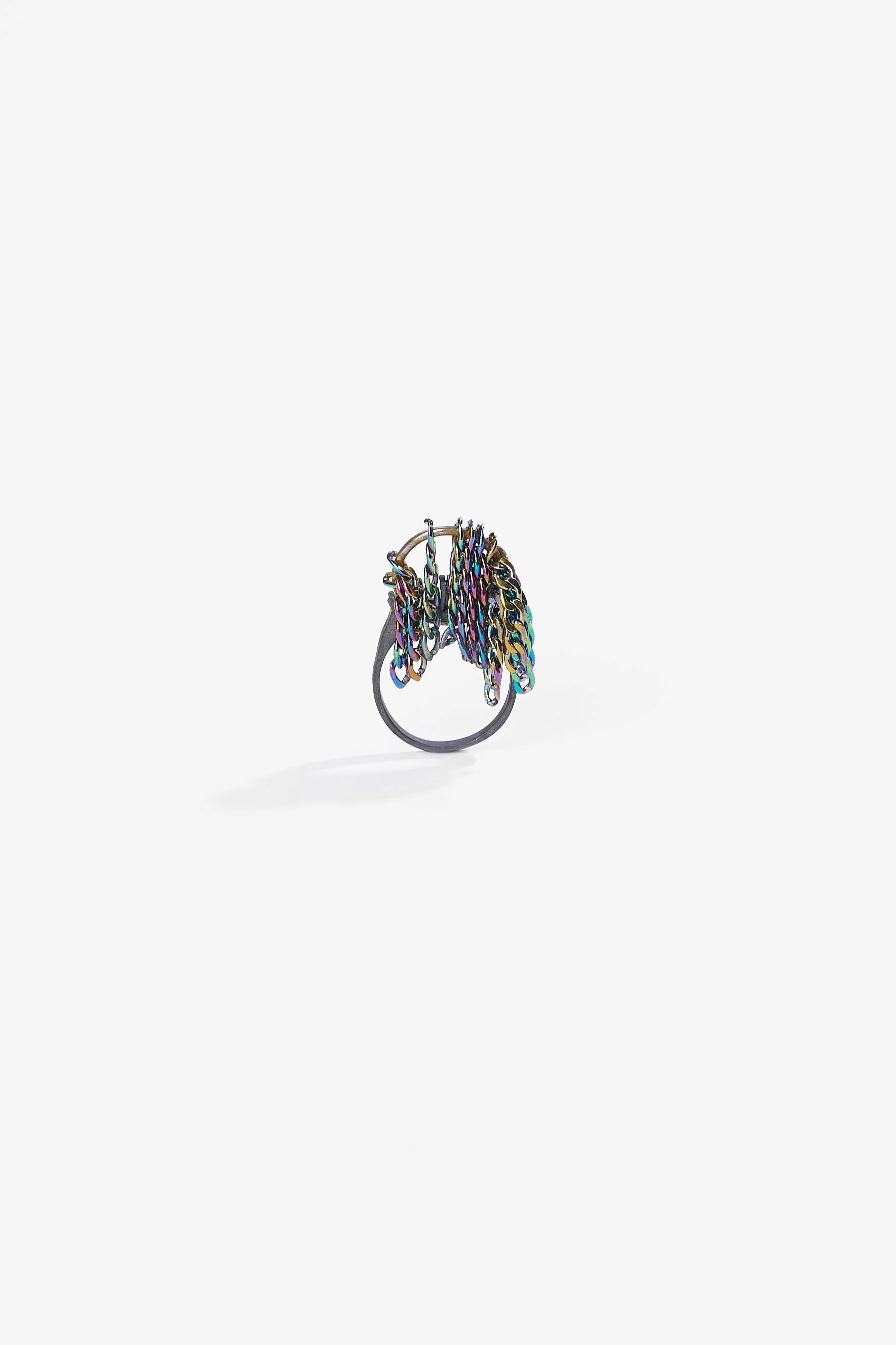 Debris Facility, Capsule Collapsing, oxidised silver, surgical stainless steel, aluminium, 3D printed nylon, anodised stainless steel, printed acetate, mirror frame, acrylic display, acrylic paint, iridescent pigment, 2026. Metal rings $365 each. Pho