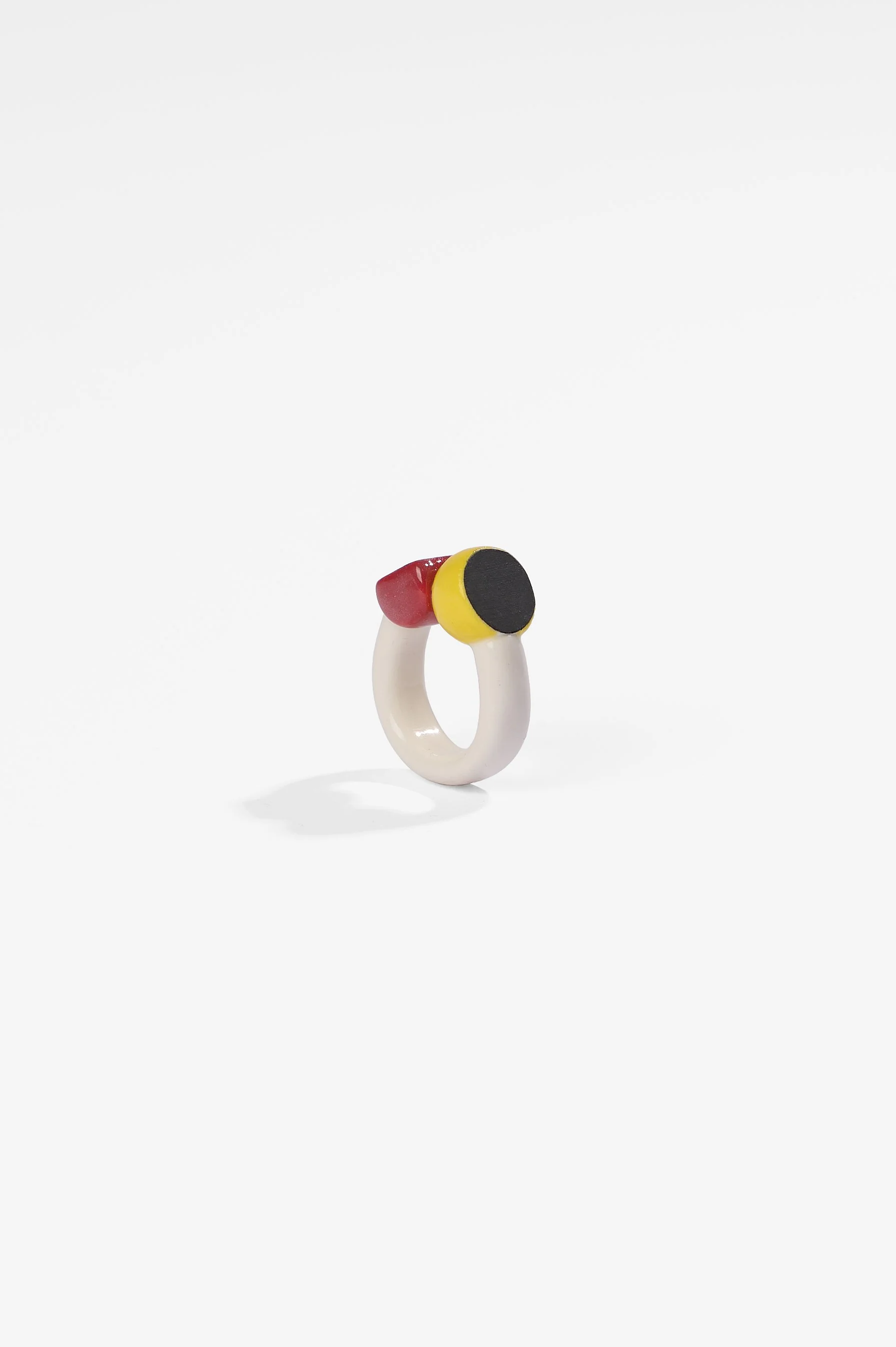 Manon van Kouswijk, Rings for Found Hands (red, yellow, black and white), porcelain, dimensions vary per ring, 2026, $590 each. Photography: Ross Coulter