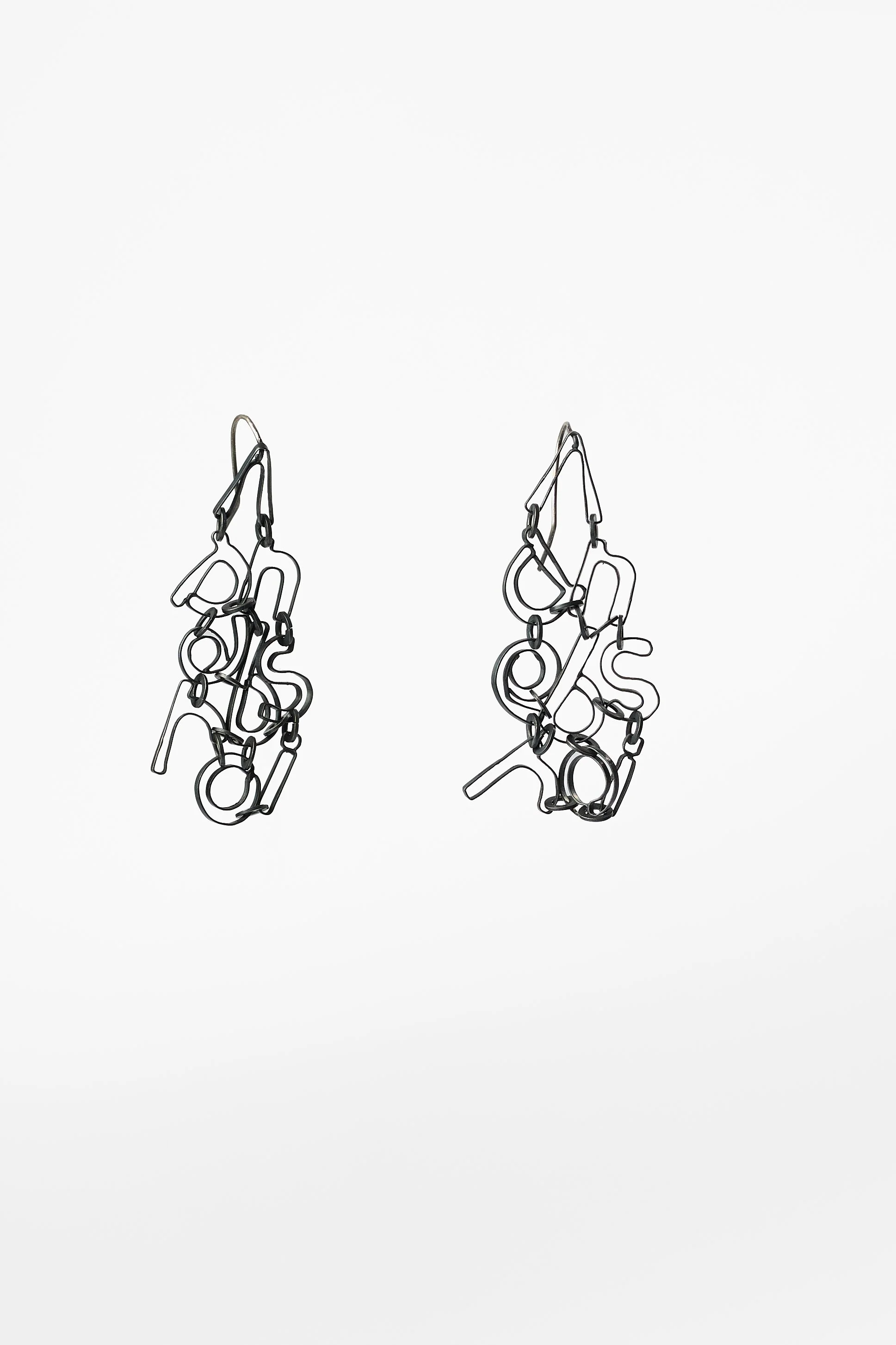 62. Roseanne Bartley, ‘Every earring tells a story: 8 letters’, earrings, 2025, oxidised sterling silver, each earring measures: 7.5x4x1.5cm. Price: $650; also available ‘Every earring tells a story: 6 letters’, earrings, 2025, oxidised sterling silv