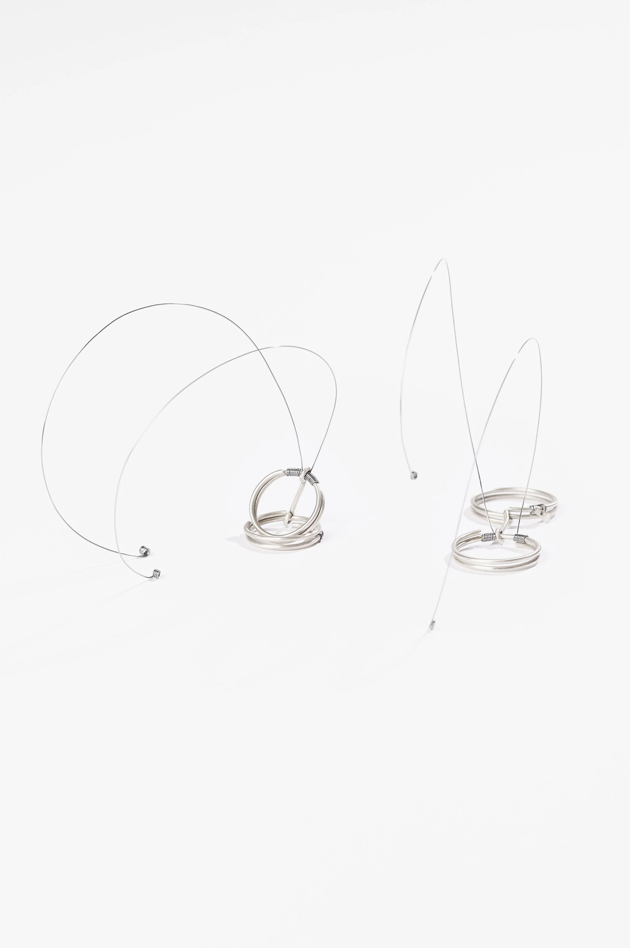 Nadia Cao-Alahananthan, Ơi (Uh-ee) Ring, sterling silver wire, binding wire, 10 x 1.9 x 6cm, 2026, $190 each. Photography: Ross Coulter