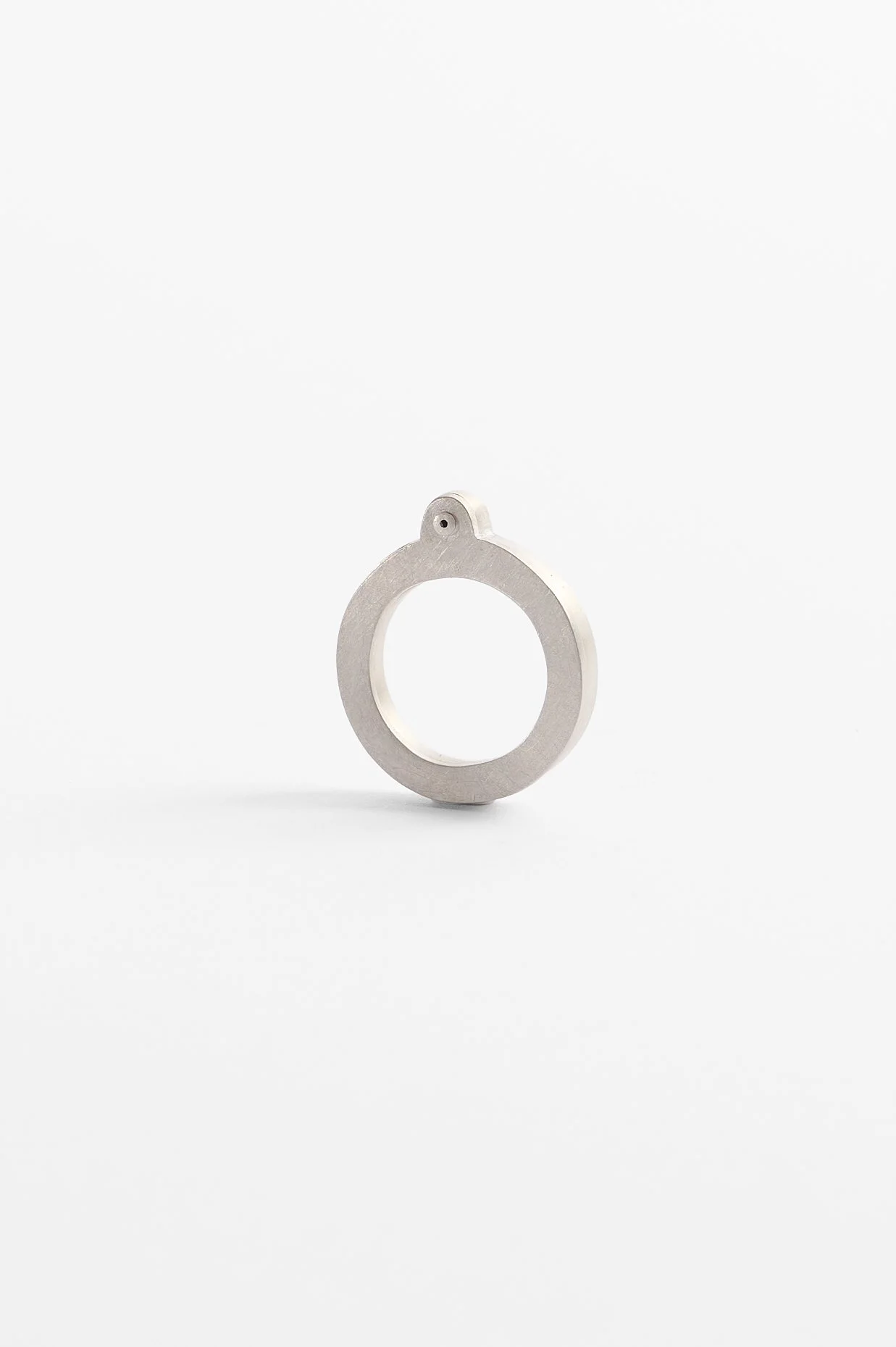 Katie Collins, Promises kept, sterling silver, 2.4 x 2.9 x .5cm, approx. size M, 2025. Photography: Ross Coulter.