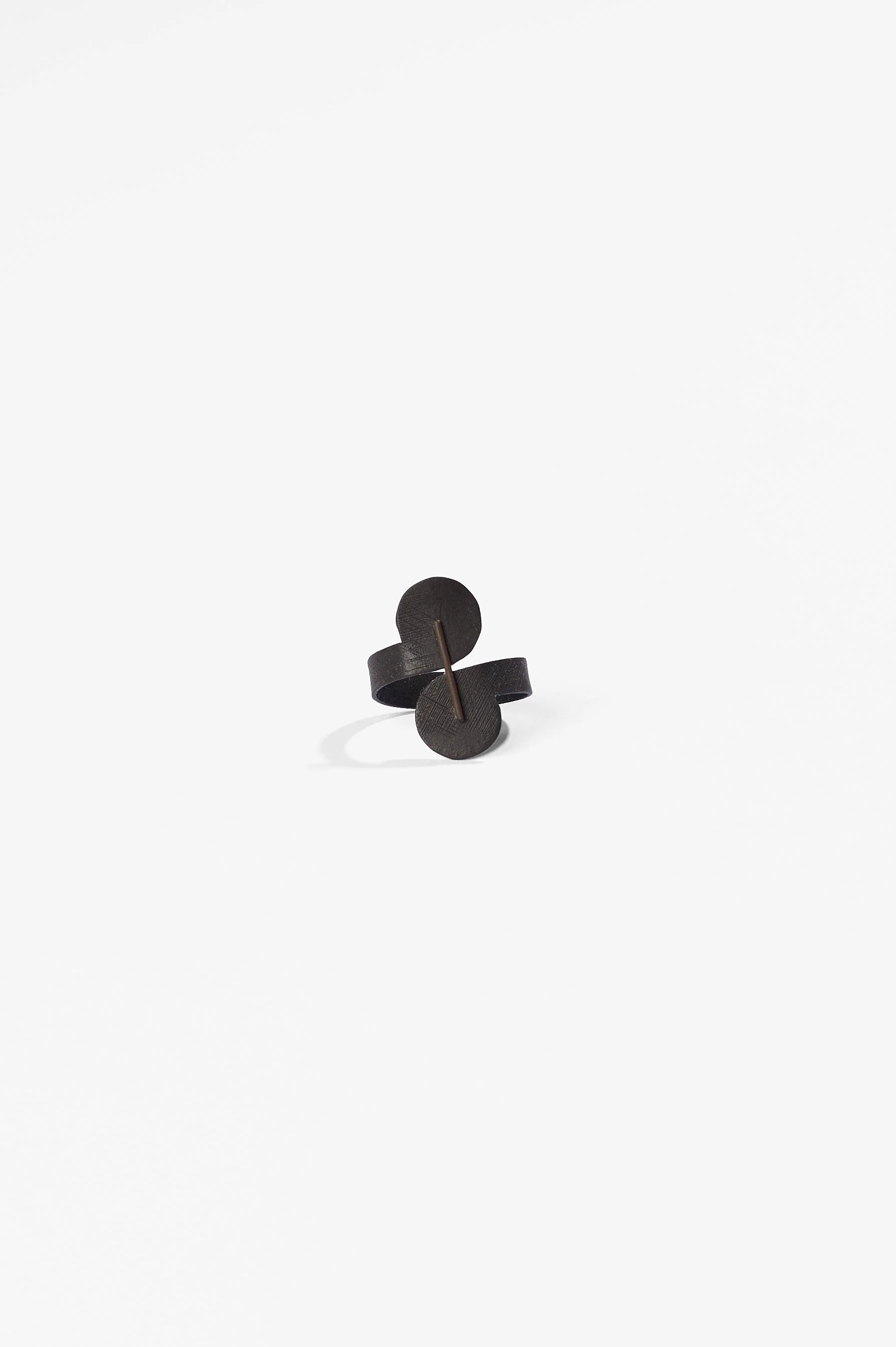 Sue Buchanan, Comma #3, mild steel, stainless steel, blackened, 2026, $220. Photography: Ross Coulter