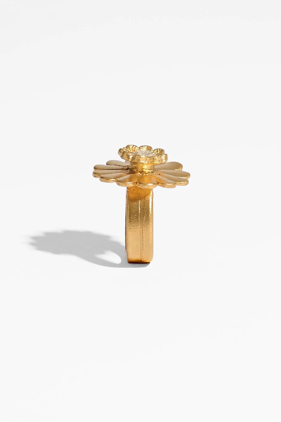 Laila Marie Costa, Untitled 14 (large gold dual flower large daisy shape plus smaller flower horizontal), bronze (gold plated) and white diamond powder, 3 x 3 x 3cm, 14.5 grams, $1100. Photography: Ross Coulter