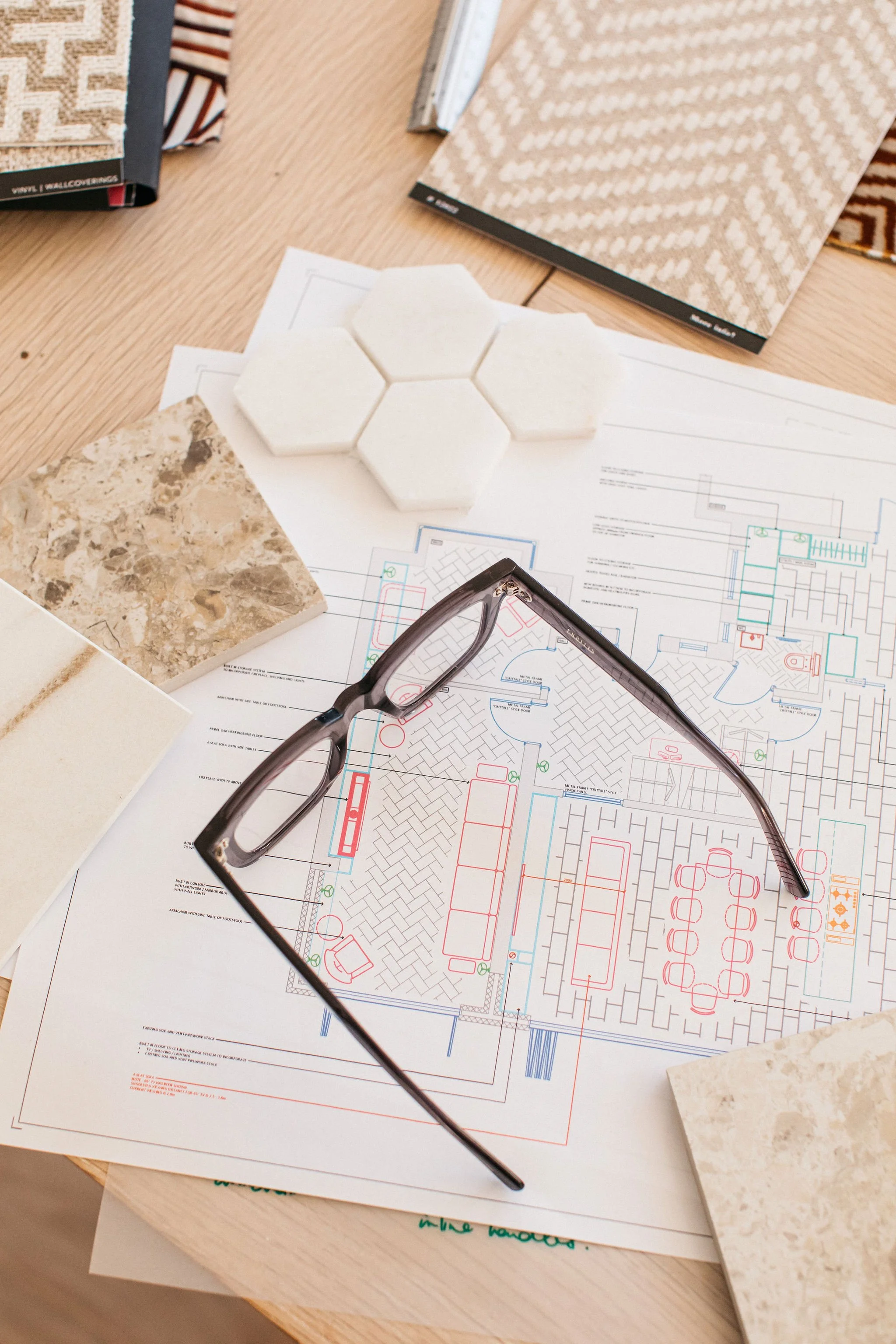 Material samples laid out for review, used to help answer early questions to ask an interior designer about finishes and design direction.