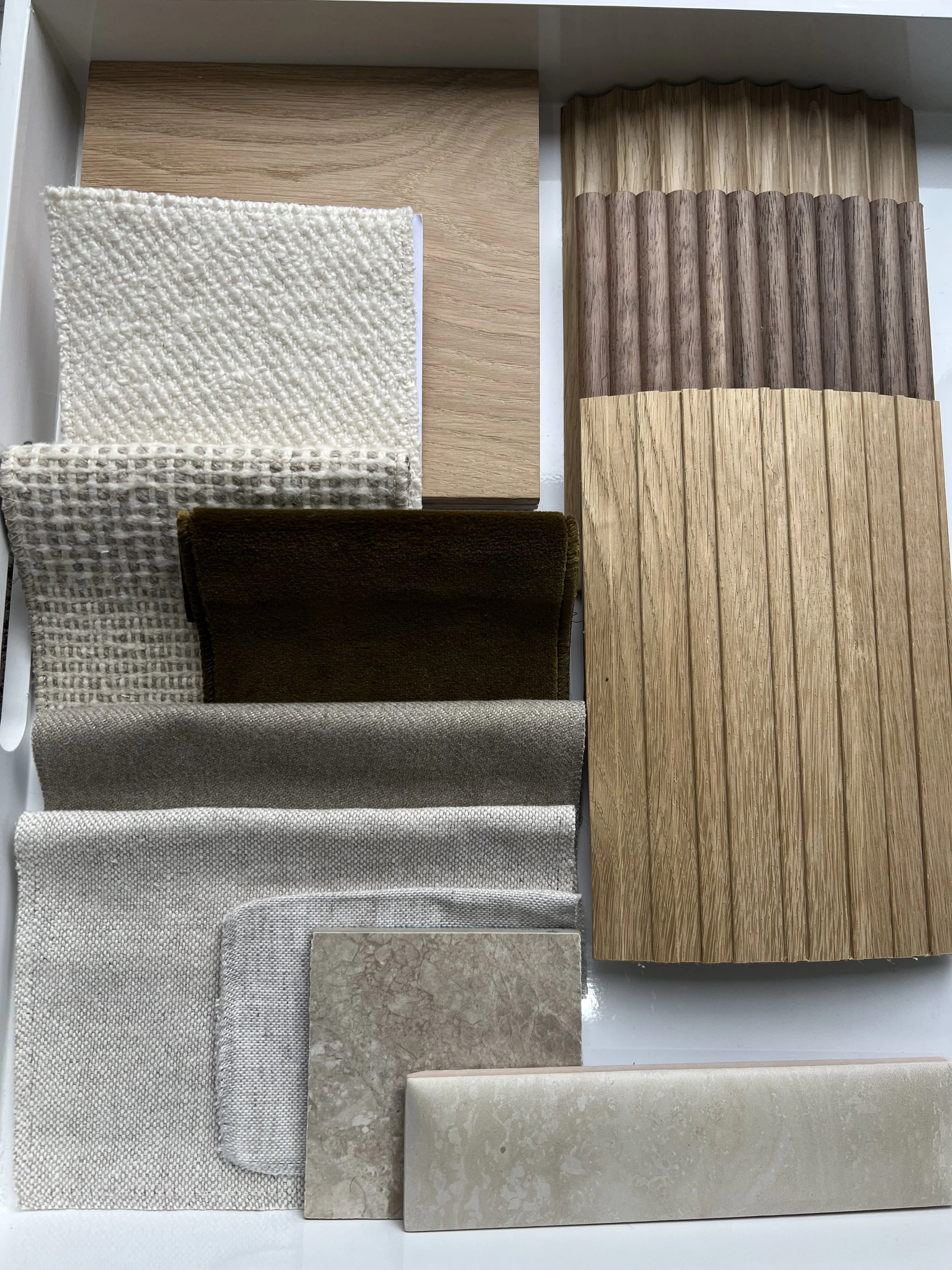 texture in interior design including wool, wood,linen and marble