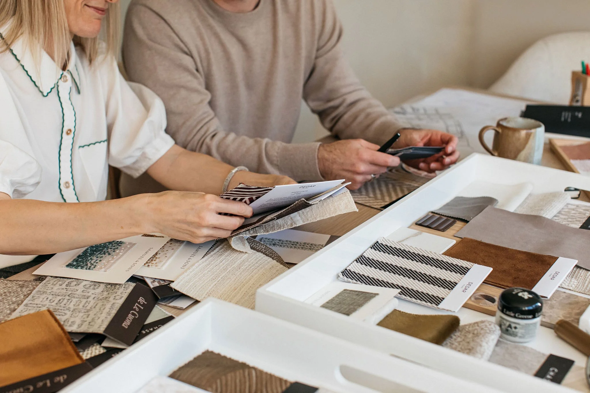 Material samples on an interior designers desk at Chapter Seven Design.