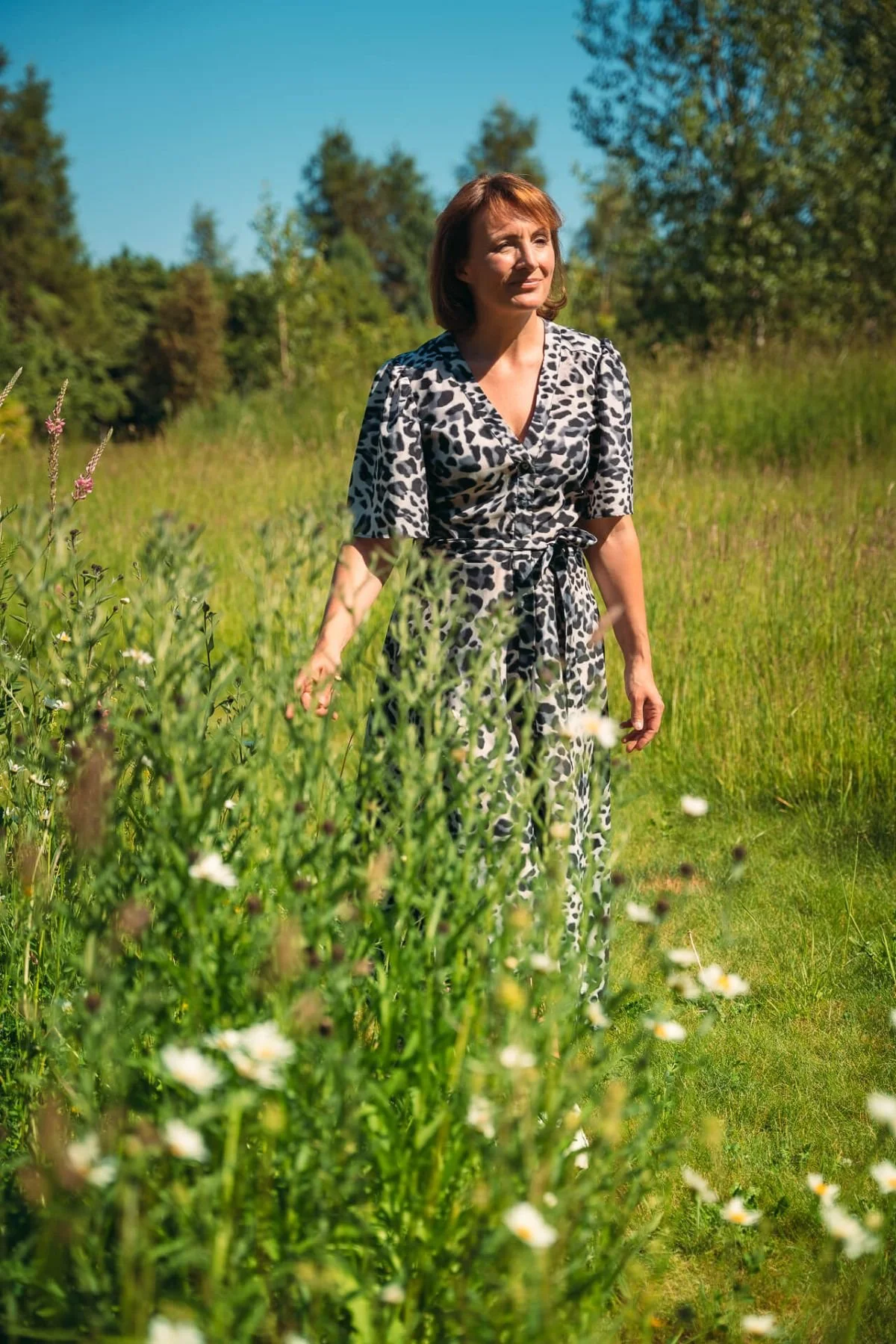 Tina walking in daisies