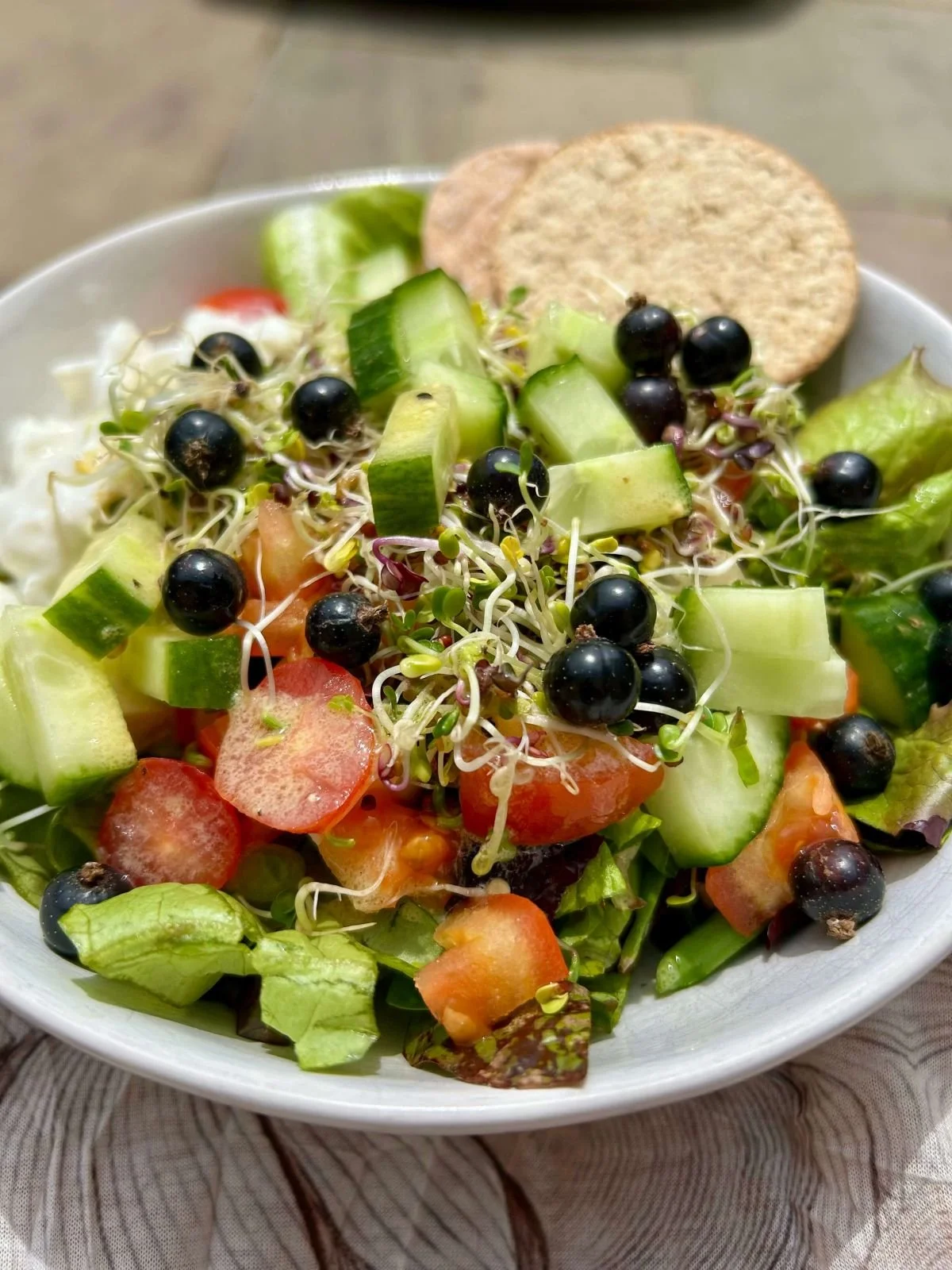 Fresh salad and crackers on a plate