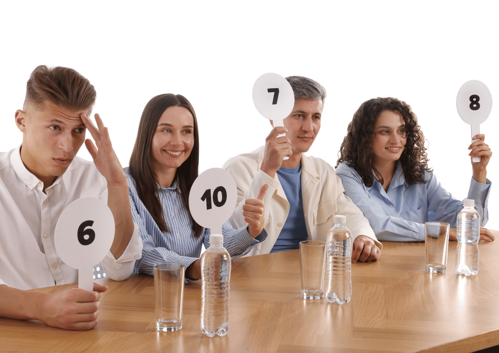 four judges at a desk holding up different numbers