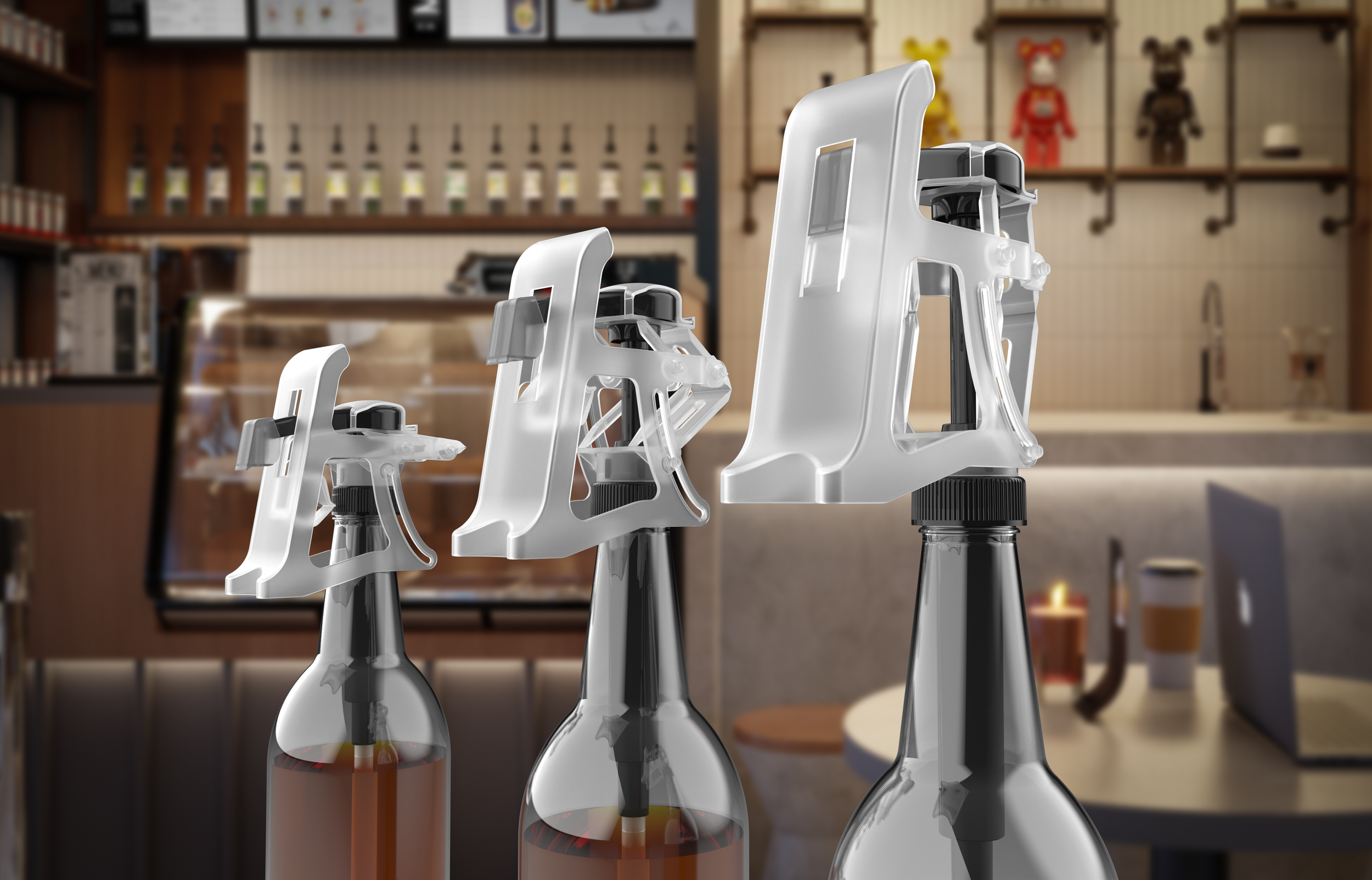 Three spray bottles with white trigger heads on a countertop in a coffee shop or cafe setting.