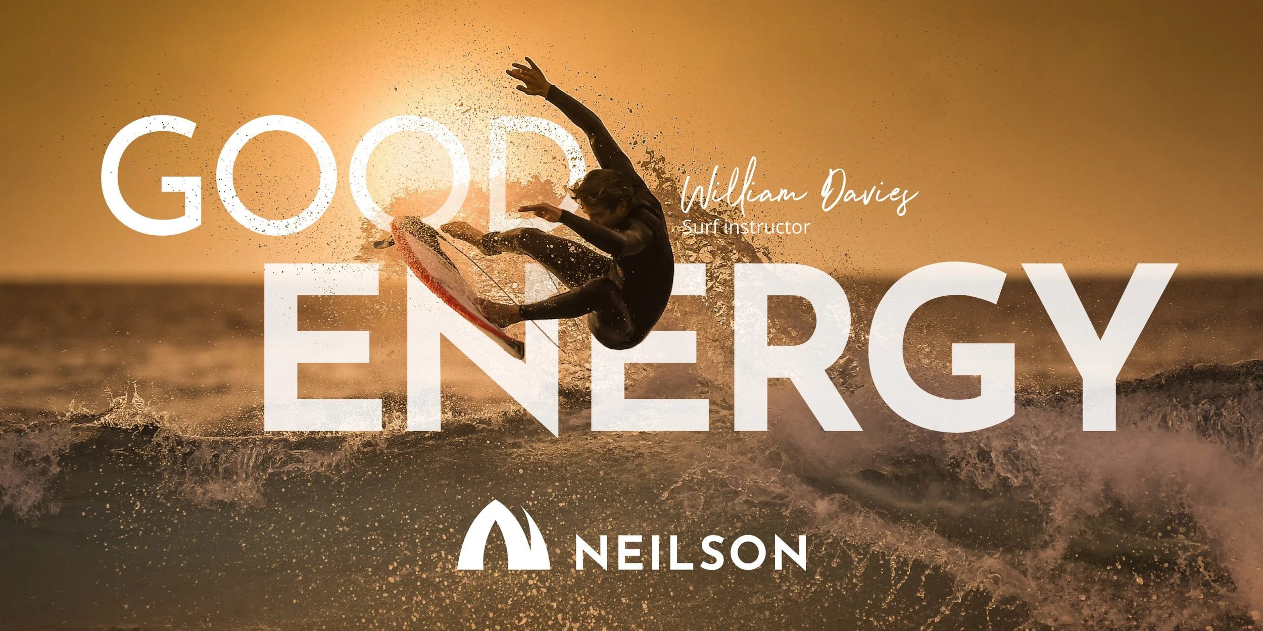 Surfer in air, words good energy in background