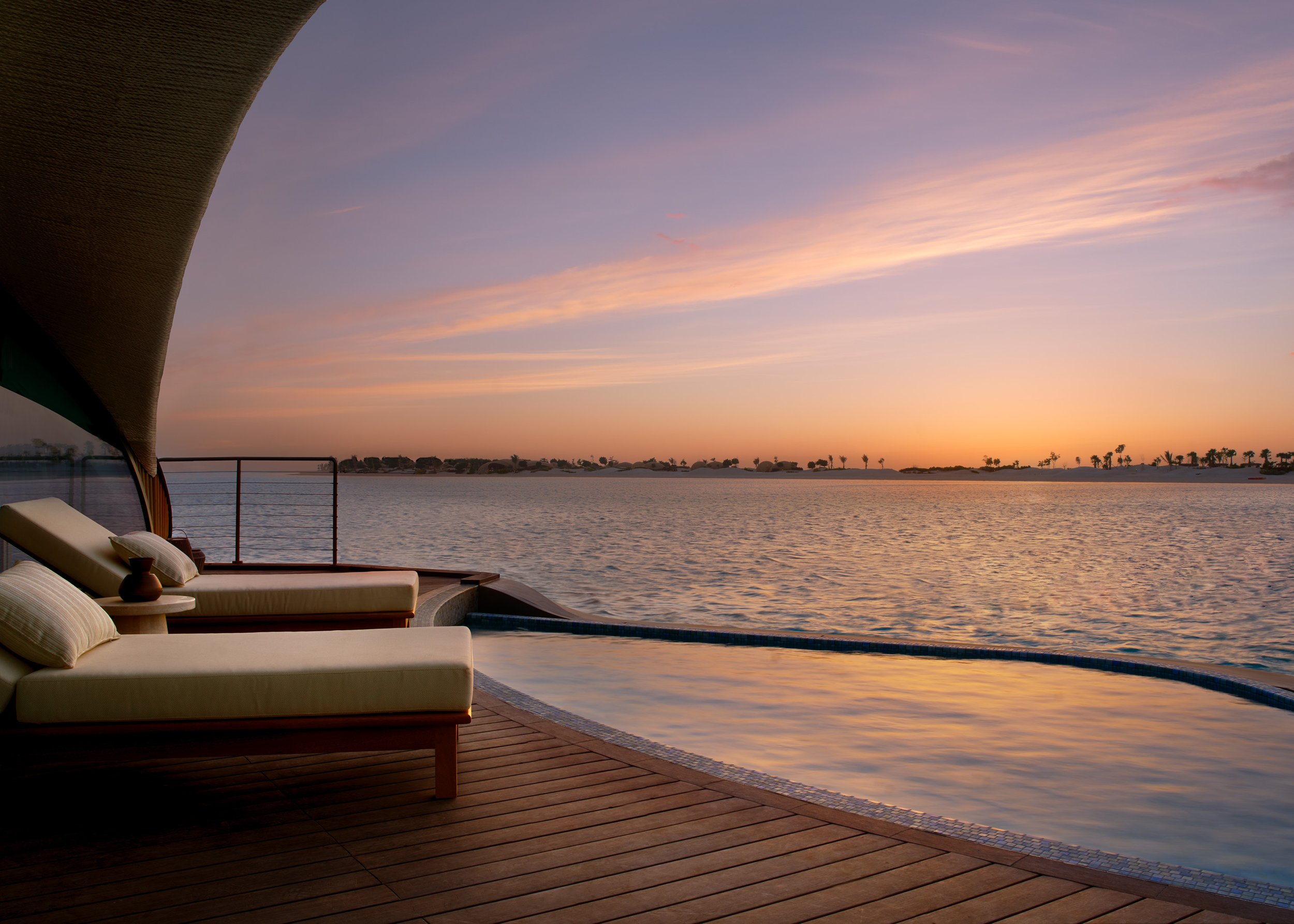 Nujuma - Overwater villa pool - sunset deck.jpg