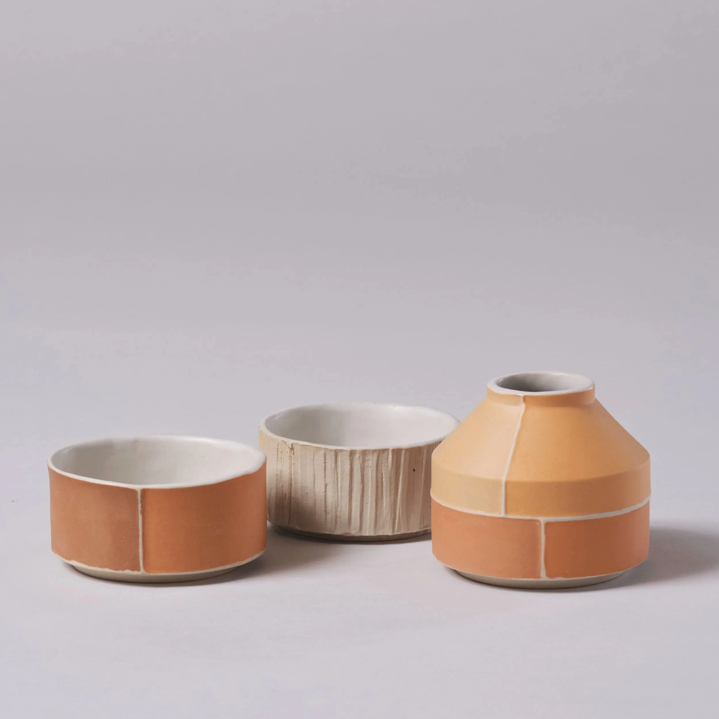 Range of stackable slipcast contemporary Brutalist inspired ceramic pieces