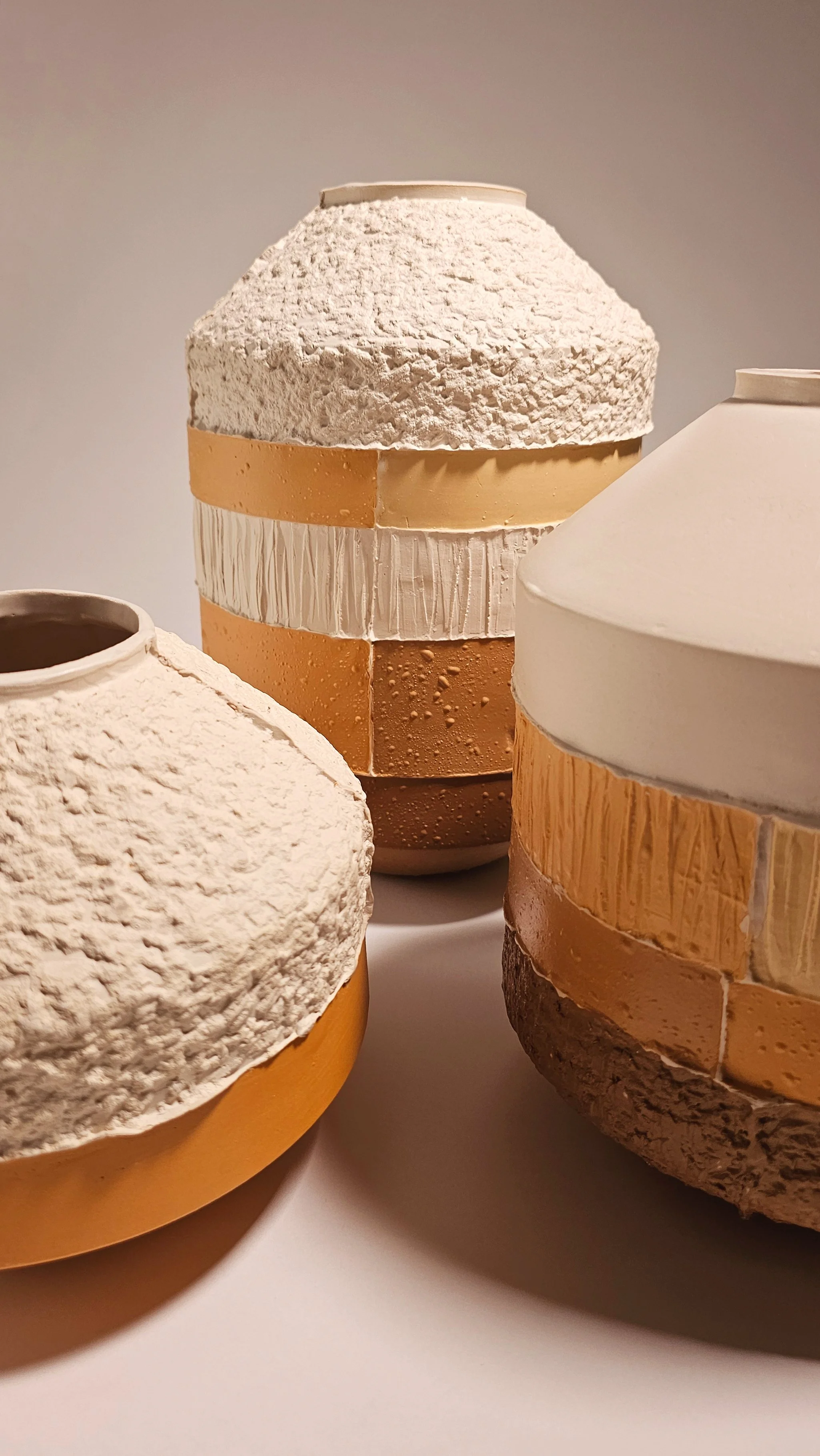 Close-up of three ceramic vessels