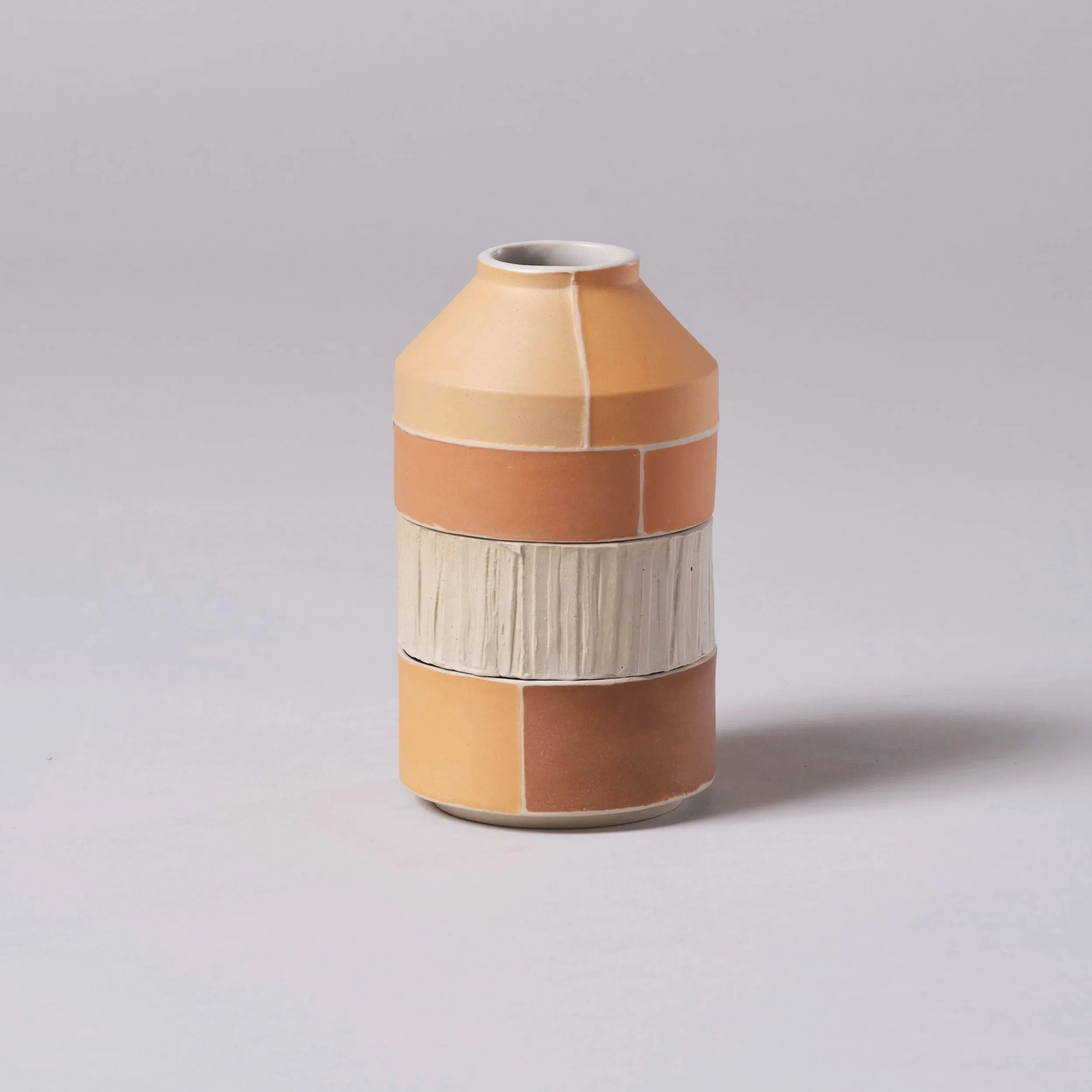 Stacked range of slipcast contemporary Brutalist inspired ceramic pieces