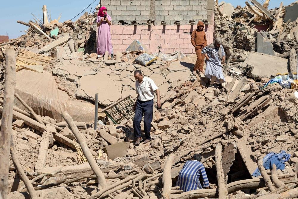  Villagers inspect the rubble of collapsed houses in Tafeghaghte, southwest of Marrakech, September 10, 2023, FADEL SENNA / AFP 
