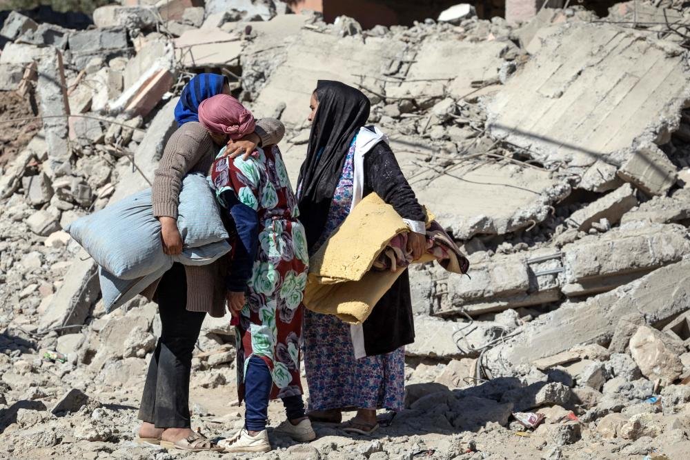  Villagers inspect the rubble of collapsed houses in Tafeghaghte, southwest of Marrakech, September 10, 2023, FADEL SENNA / AFP 