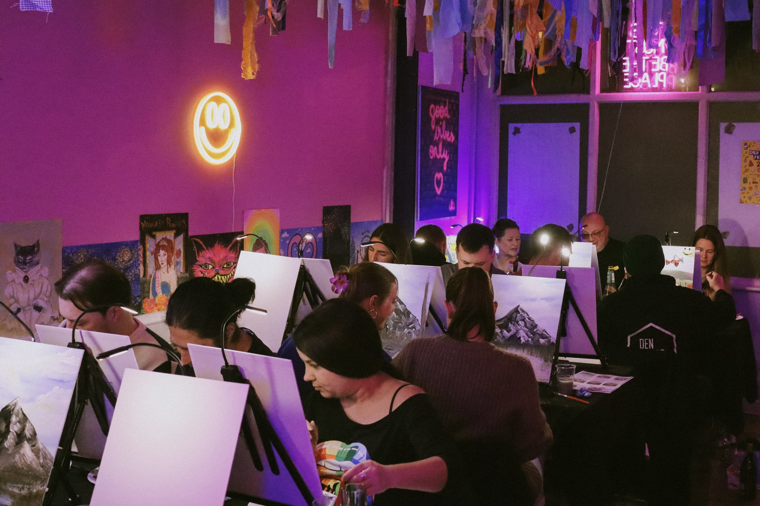 Group of people painting.