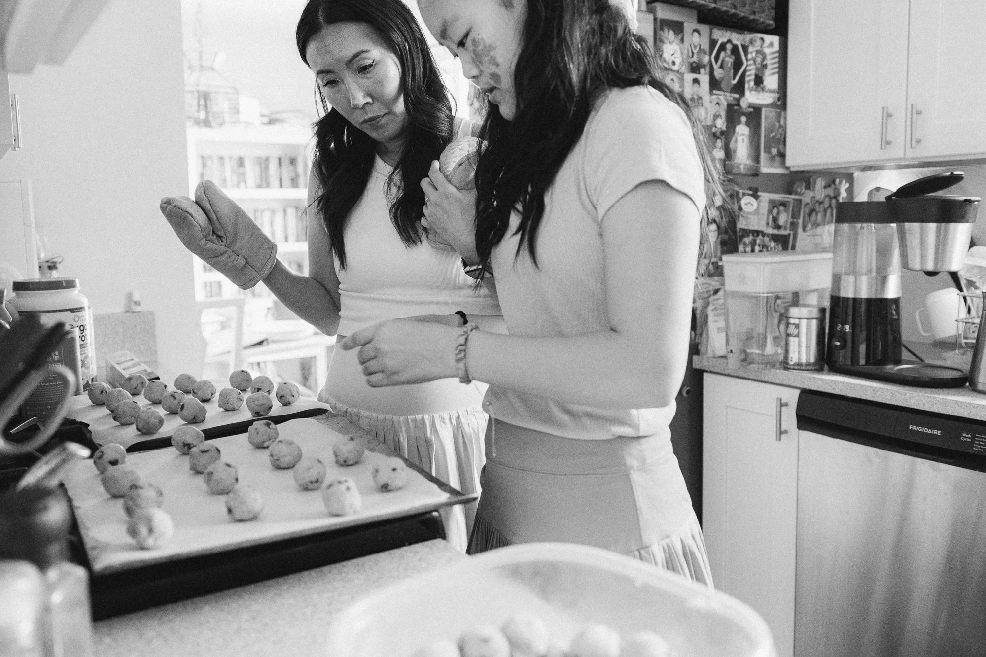Mom and teenage daughter baking cookies together in their kitchen during a documentary family photography session, Mel Usry Photography, Northern Virginia