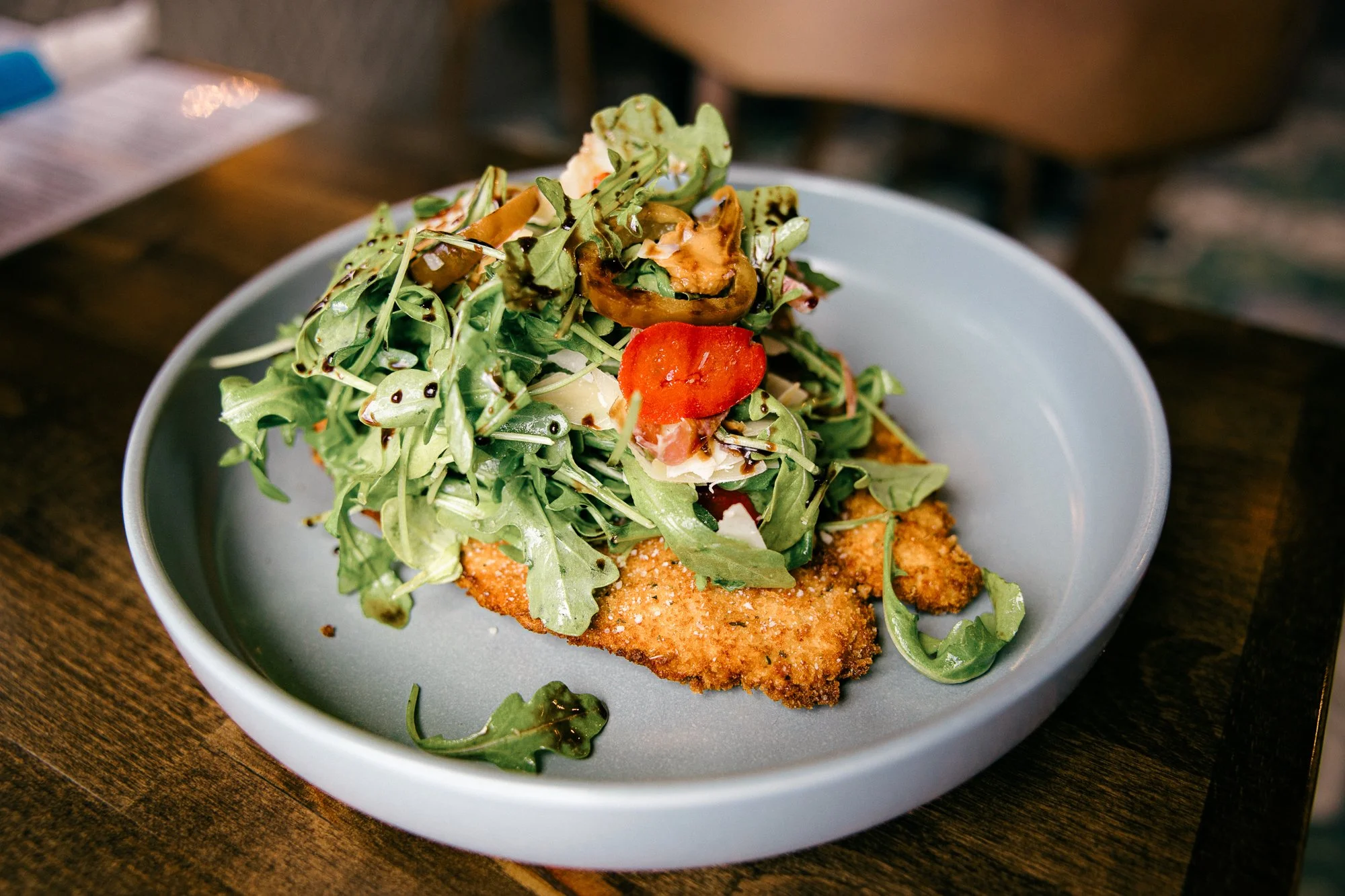 Chicken Milanese with arugula and cherry tomato — documentary brand story session by Mel Usry Photography, Sterling, Virginia