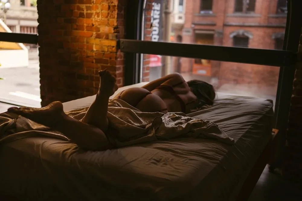 Classy boudoir portrait celebrating a milestone in a moody flattering Seattle studio