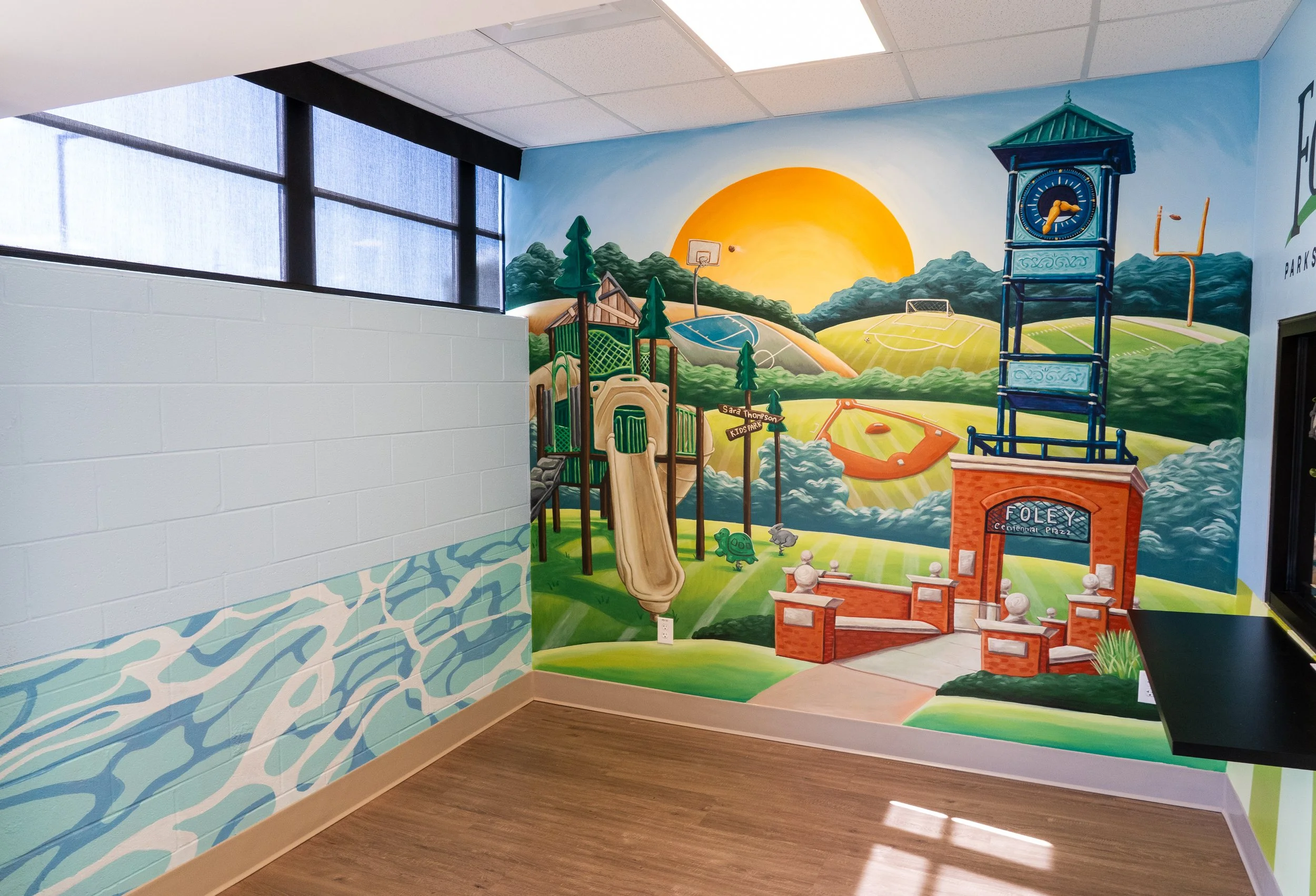 Recreation mural depicting baseball, soccer, football, and basketball in Foley, Alabama